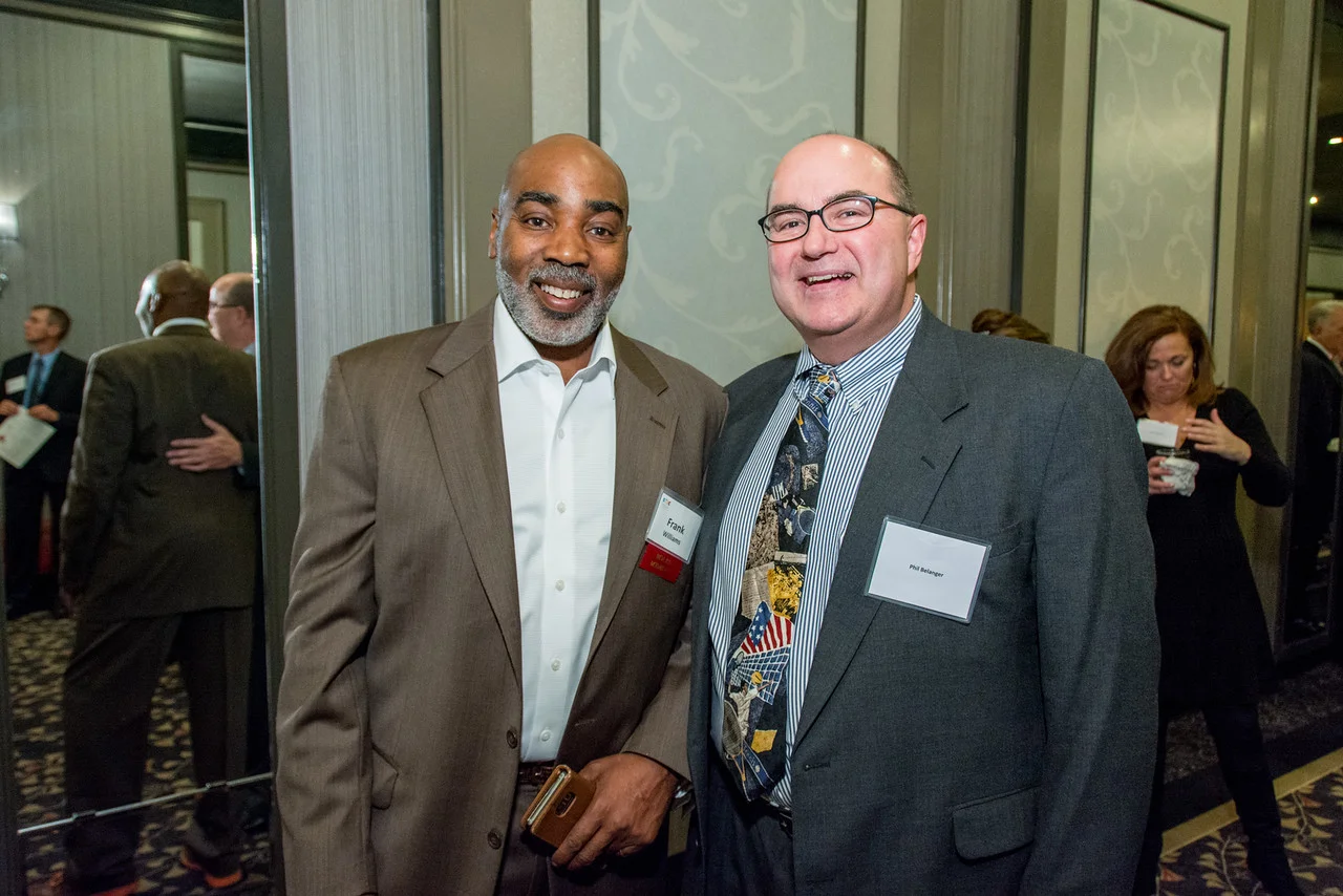 On left, Frank Williams, Boston Police Dept. Volley Against Violence Program Director with Phil Belanger, key contributor to Sportsmen's Club fundraising efforts and table host.