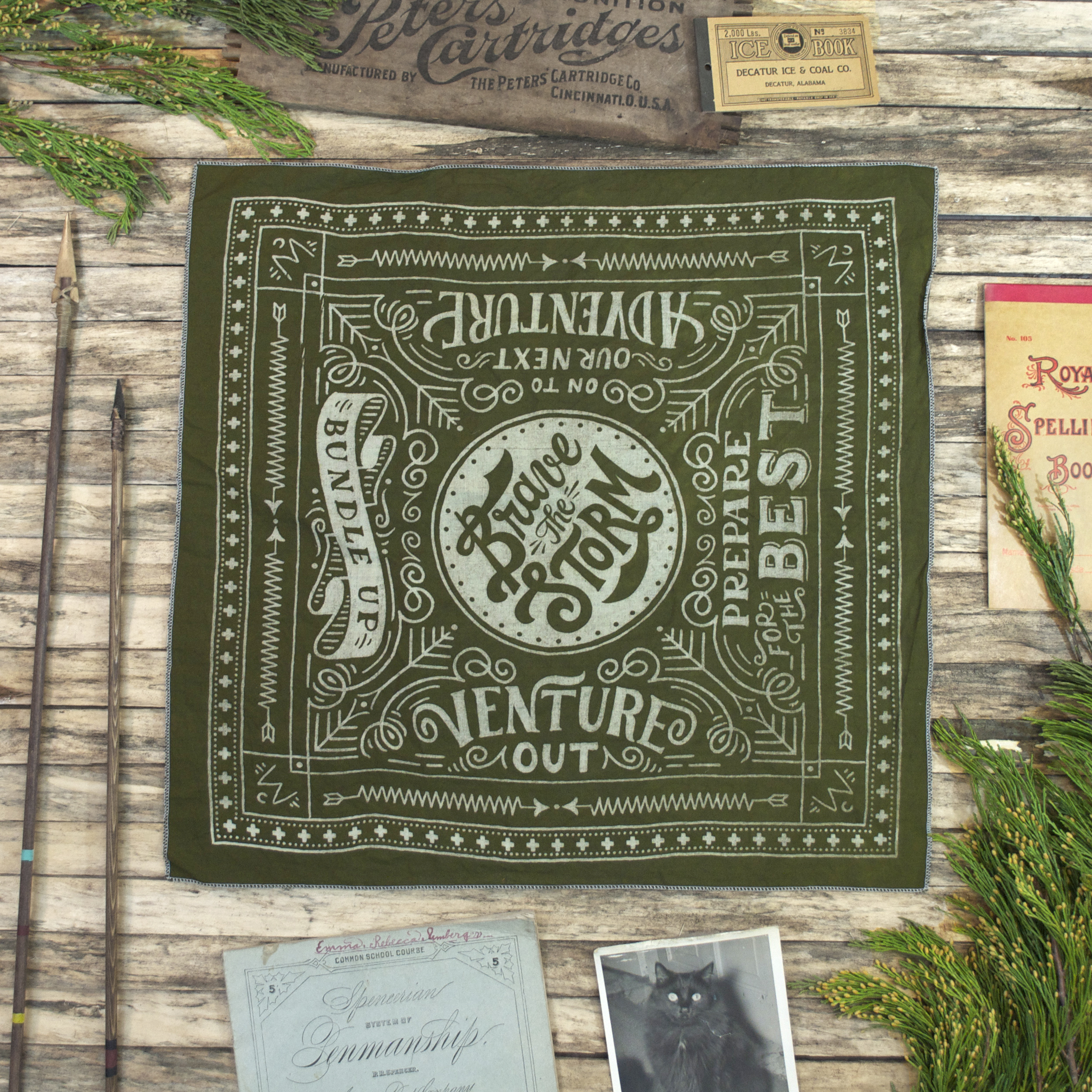 Green Winter Cabin bandana with props.jpg