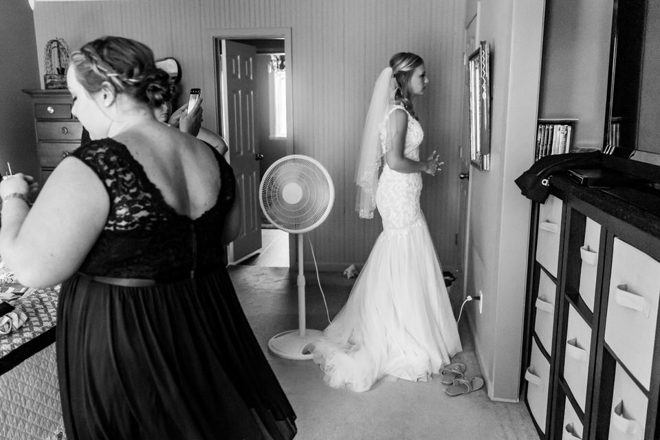  A bride checks the mirror before heading out to her wedding ceremony 