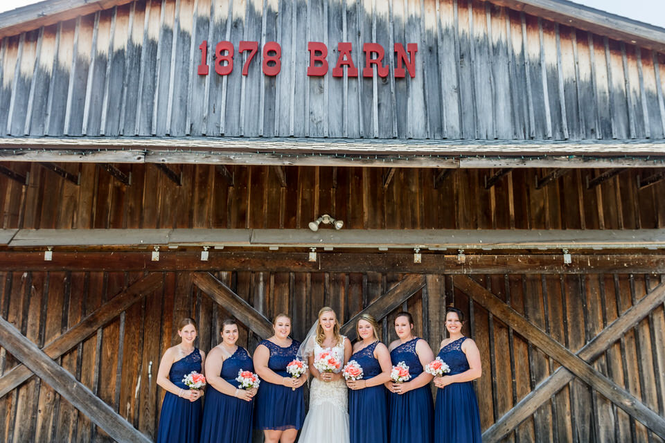  The bridesmaids pose for a photo outside of brighton barn 