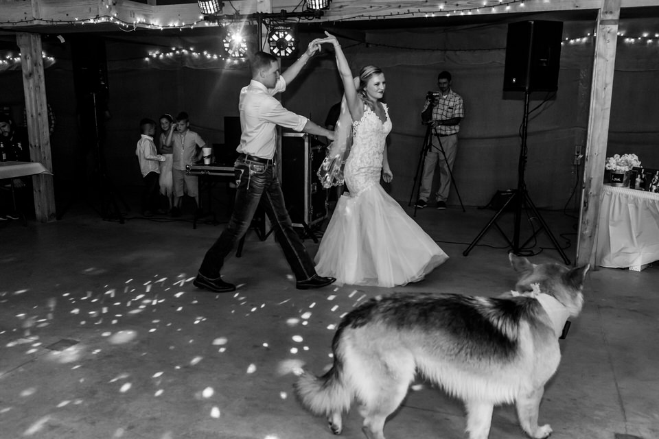  A bride and groom dance at their reception at Bridgeton Barn 