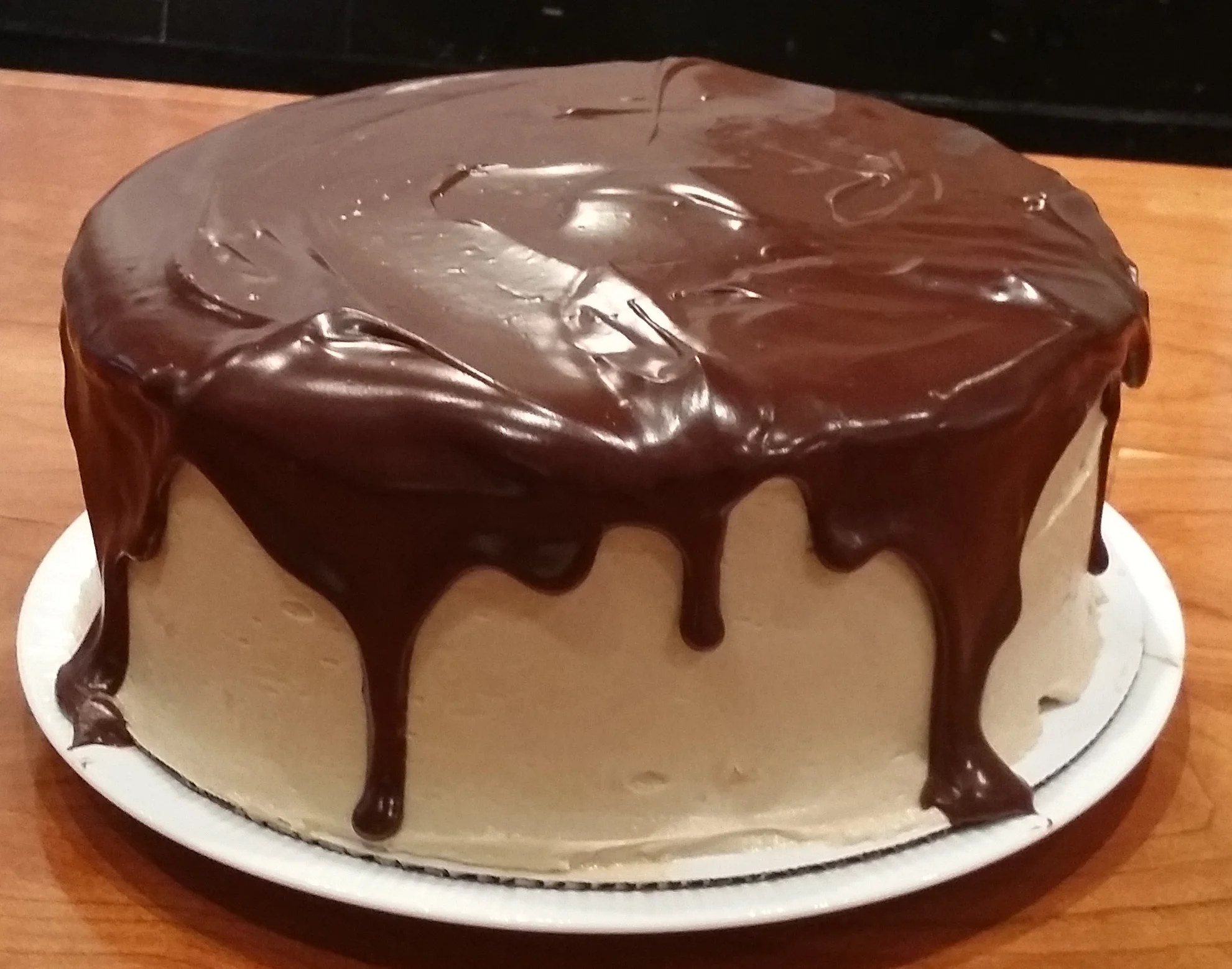Chocolate cake with vanilla buttercream and a chocolate ganache topping
