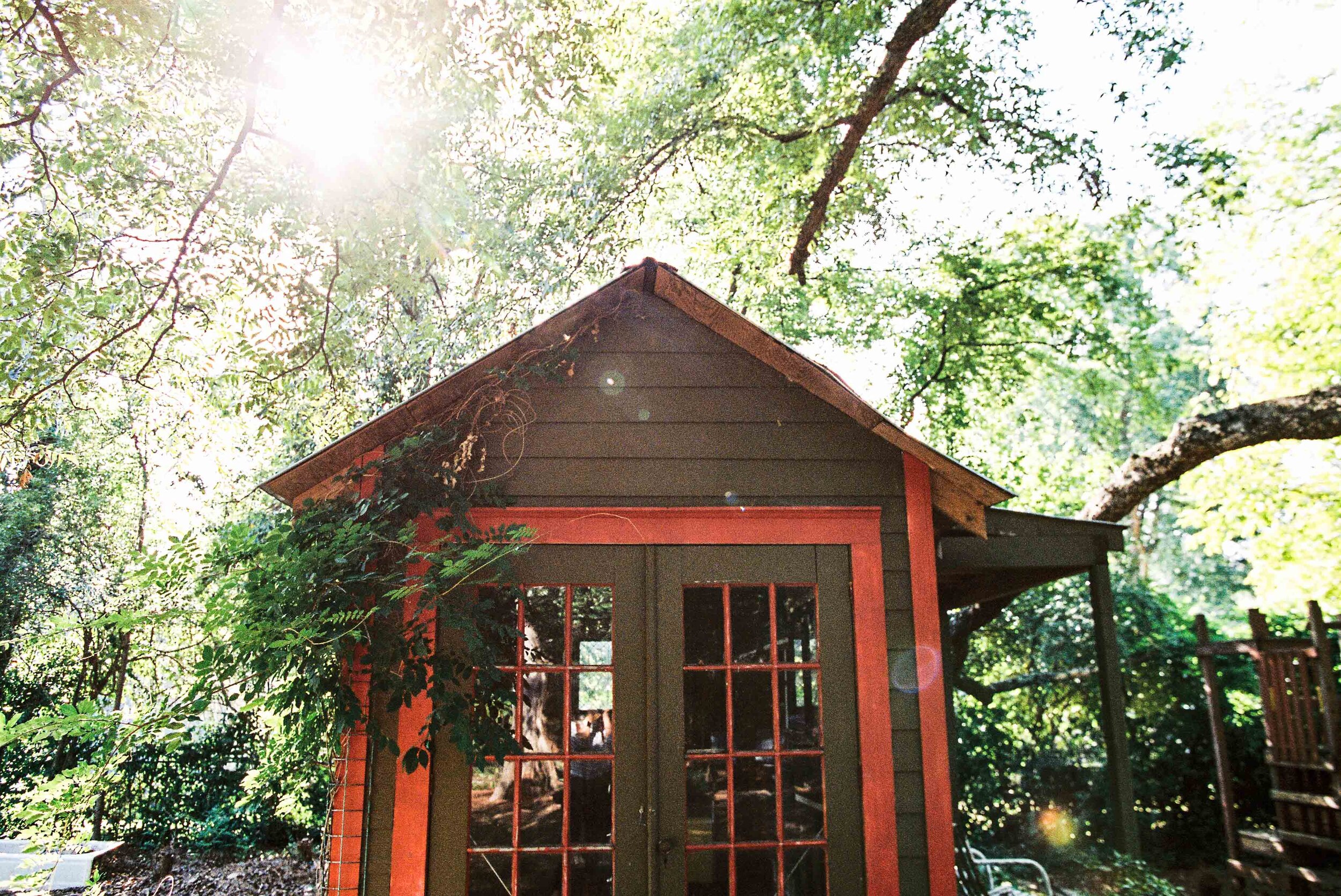 backyard playhouse with sunflare