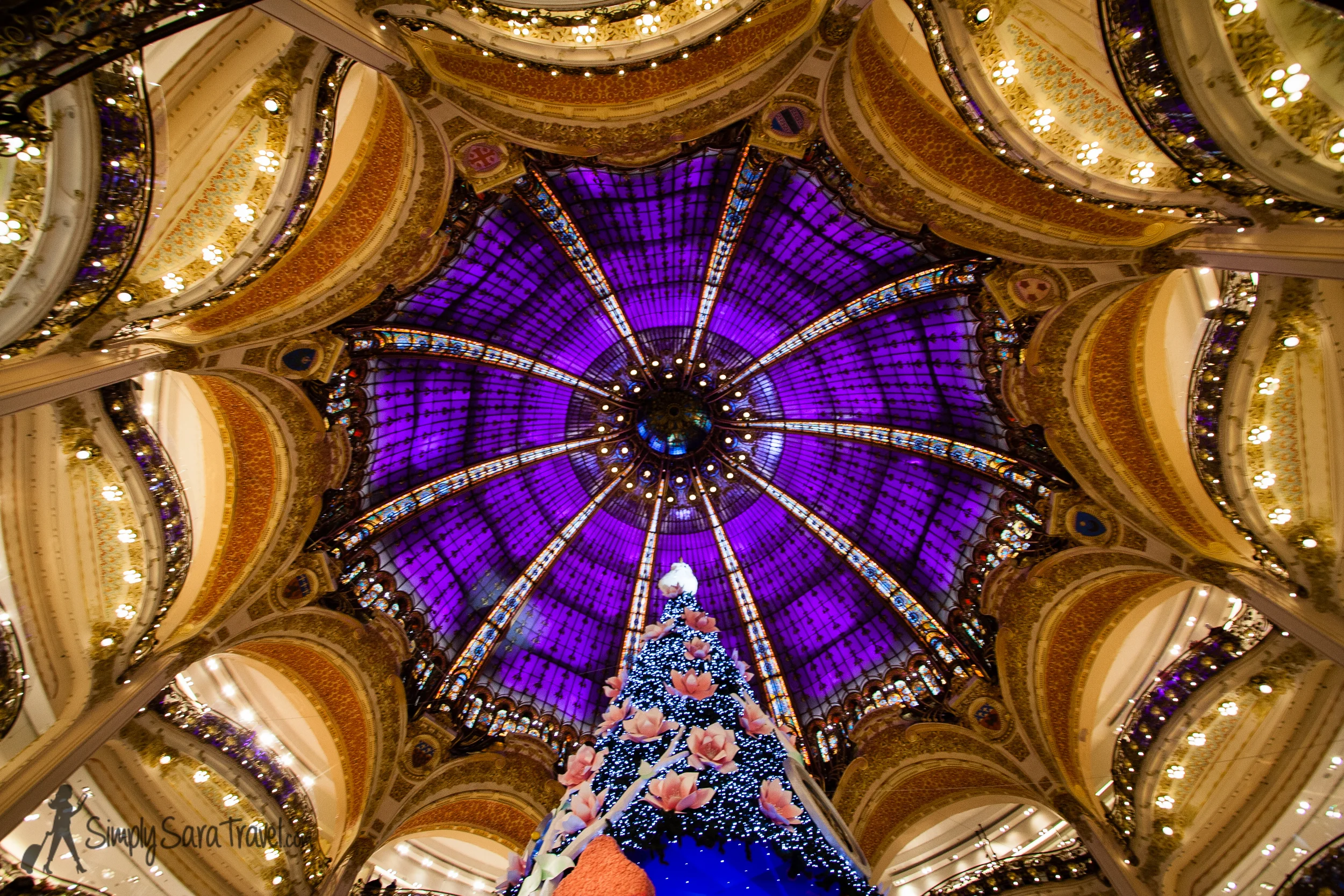 The 65-foot tall Christmas tree in the middle of Galaries Lafayette