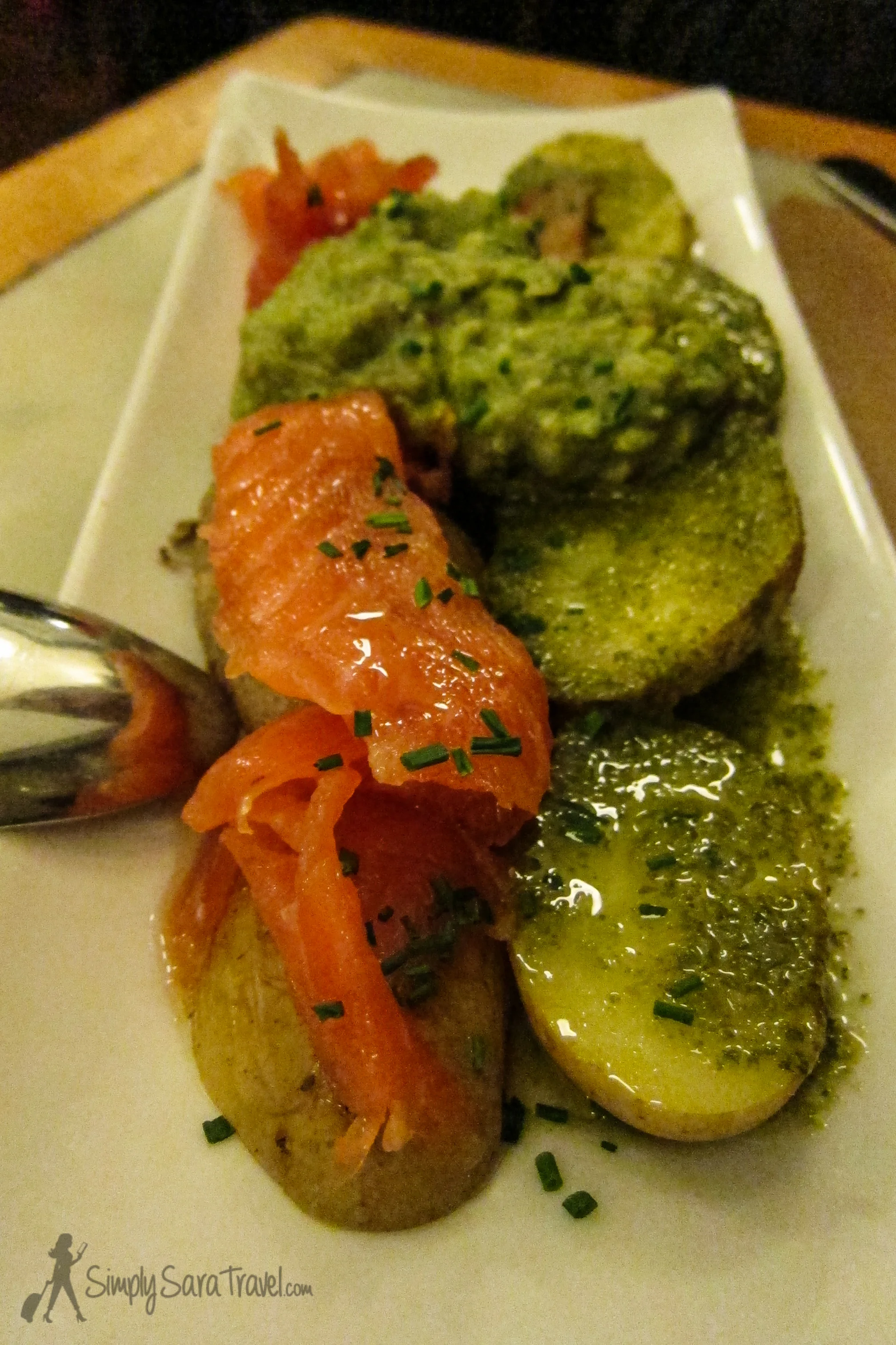 Roasted potatoes topped with smoked salmon and guacamole 