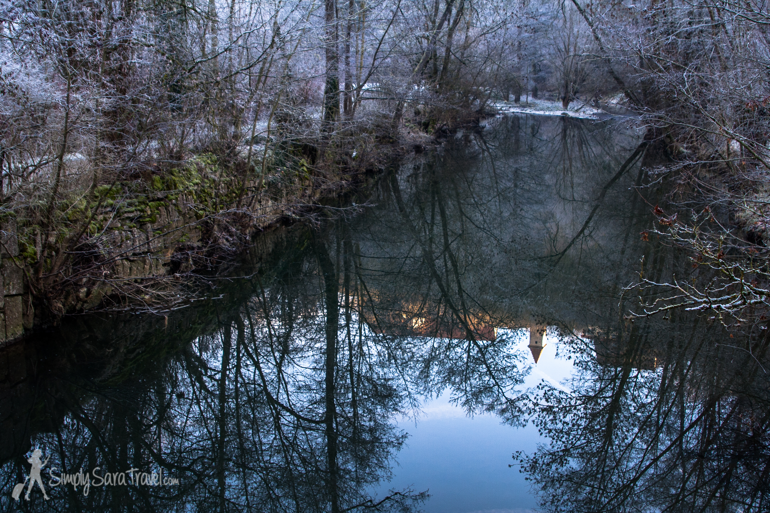 You can see Rothenburg perched up on the cliff in the reflection of the Tauber River.