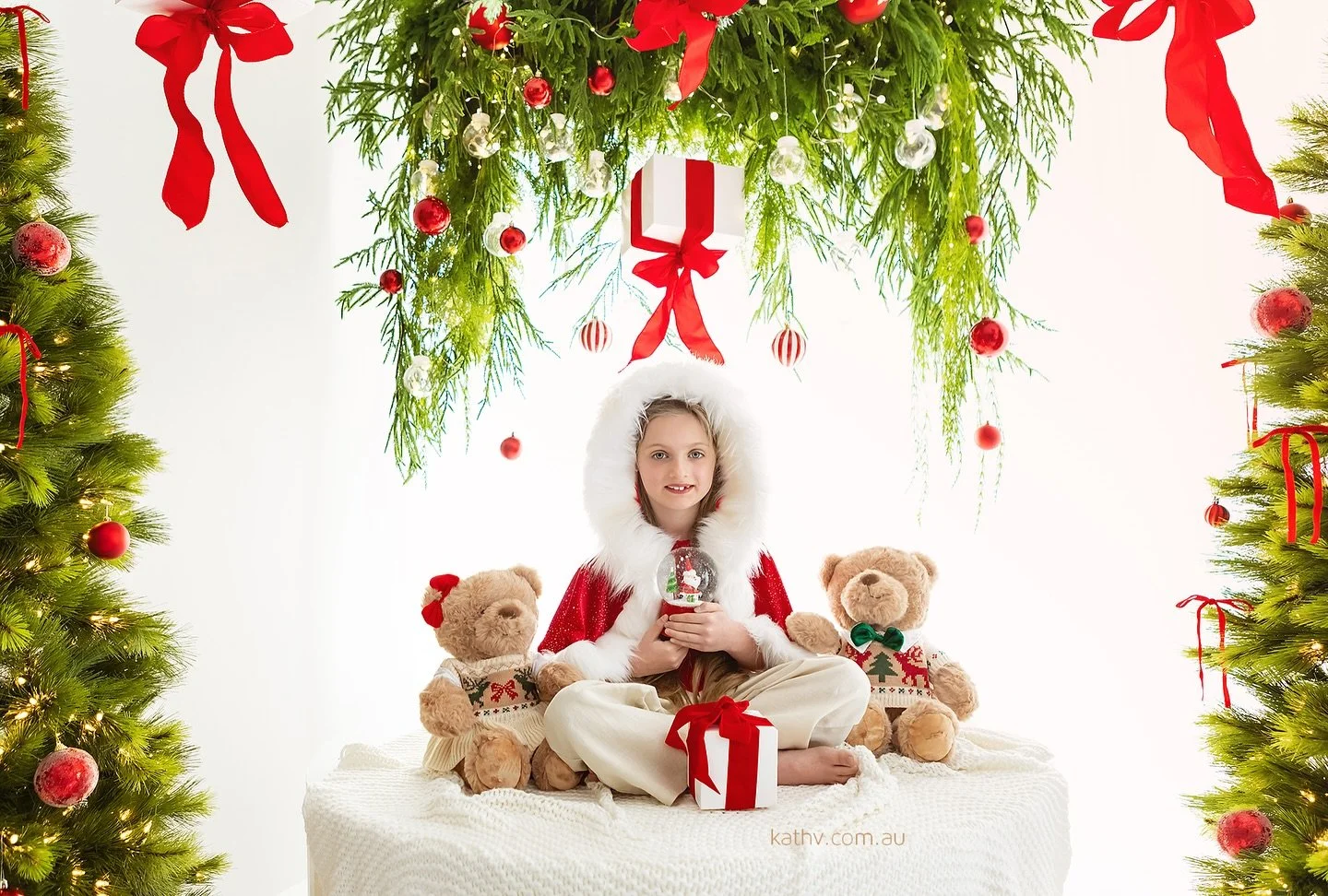 I&rsquo;ve been photographing this sweet girl for four years in a row, and every single time, her excitement melts my heart. She walks in with wide eyes, always amazed by the new Christmas setup. It makes me so happy to know she looks forward to this