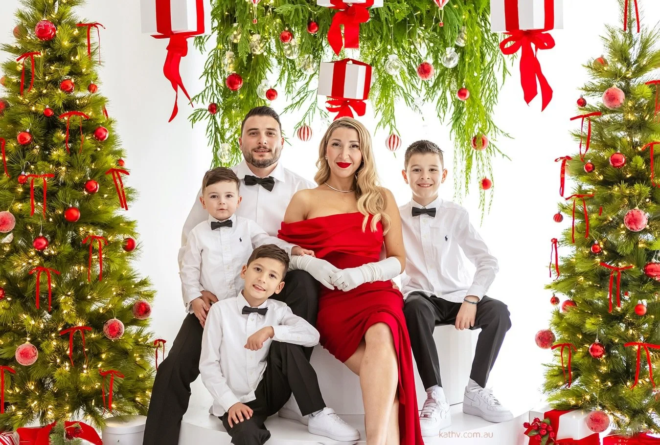 She is the heart of it all - held, loved and surrounded by her boys.