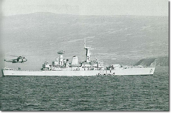 This picture shows Argonaut anchored at San Carlos after the big hit. A Sea King is bringing-in damage control equipment and the Royal Marines landing craft is delivering, I think, more welding equipment - helicopters don't like carrying compressed gas.