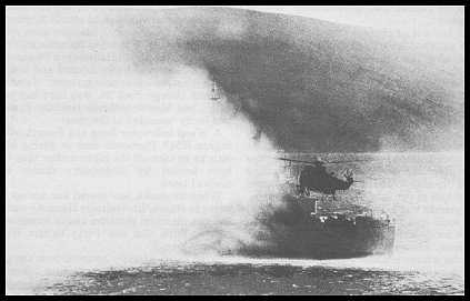Sea King delivering extra breathing apparatus from HMS Fearless 