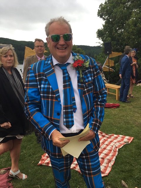 The father of the groom; just before the men in flapping white coats arrived........