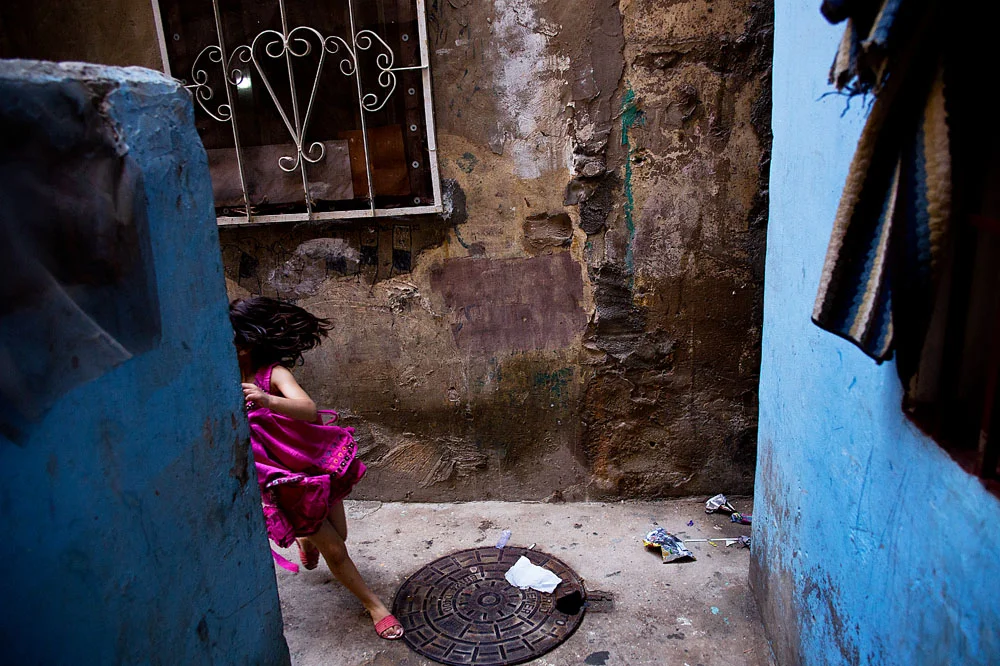  A girl plays in the alleys of Shatila. 