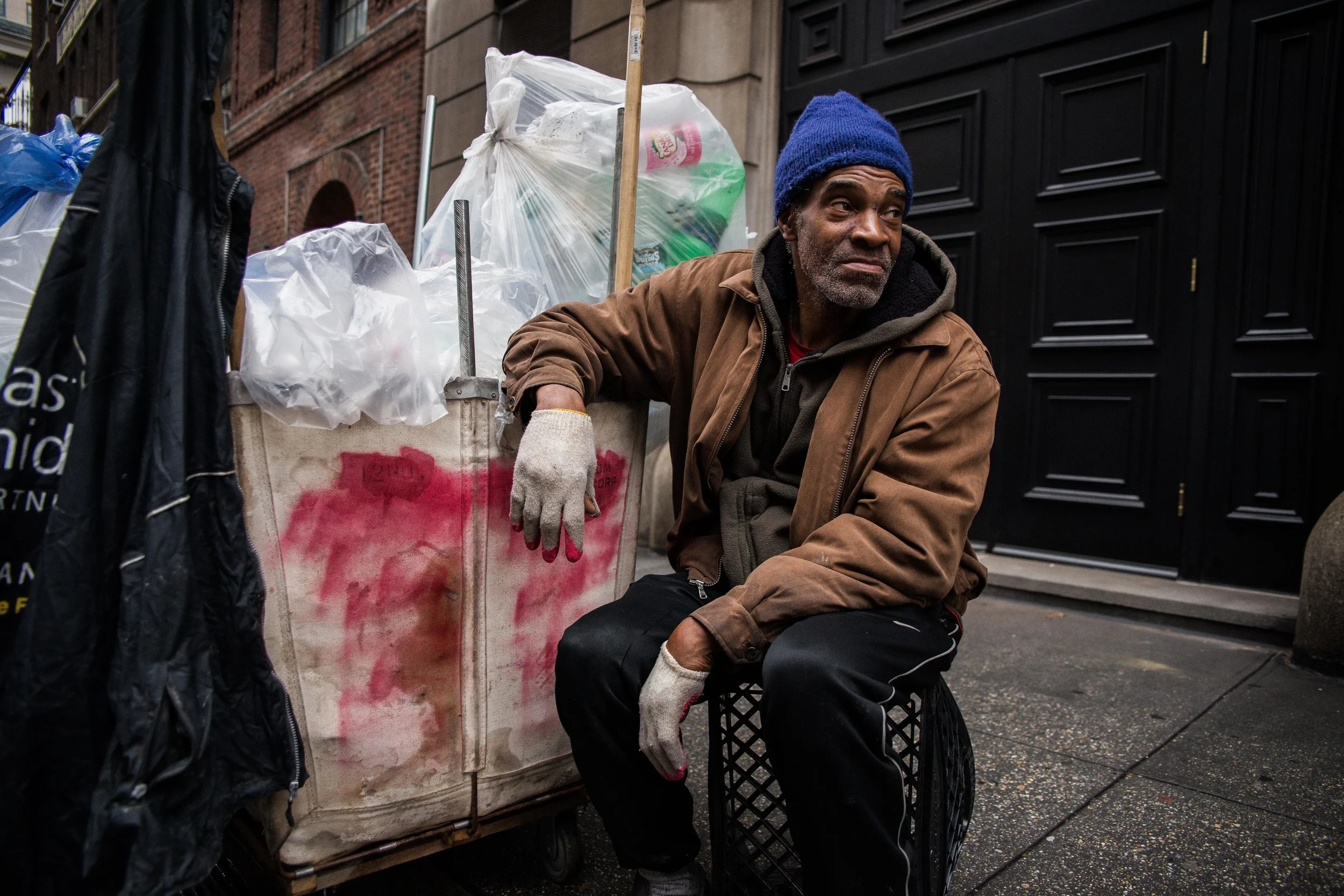   Butler waits outside a Manhattan apartment building for the maintenance man to bring out the recycling. &nbsp;Much of Butler's time is spent waiting, but if he's not there when the trash is brought out, someone else will claim it.  