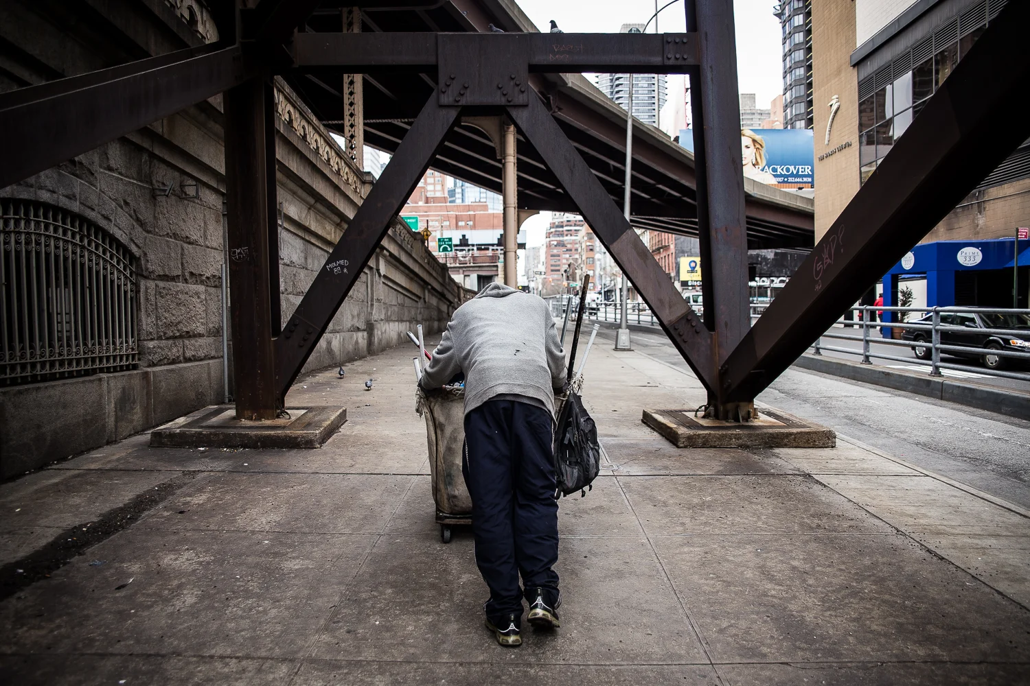  After selling his bags, Austin Butler pushes his cart back to a fence where he will lock it up for the day. &nbsp;He has often returned the next day to find his cart and whatever he had left in it gone. 