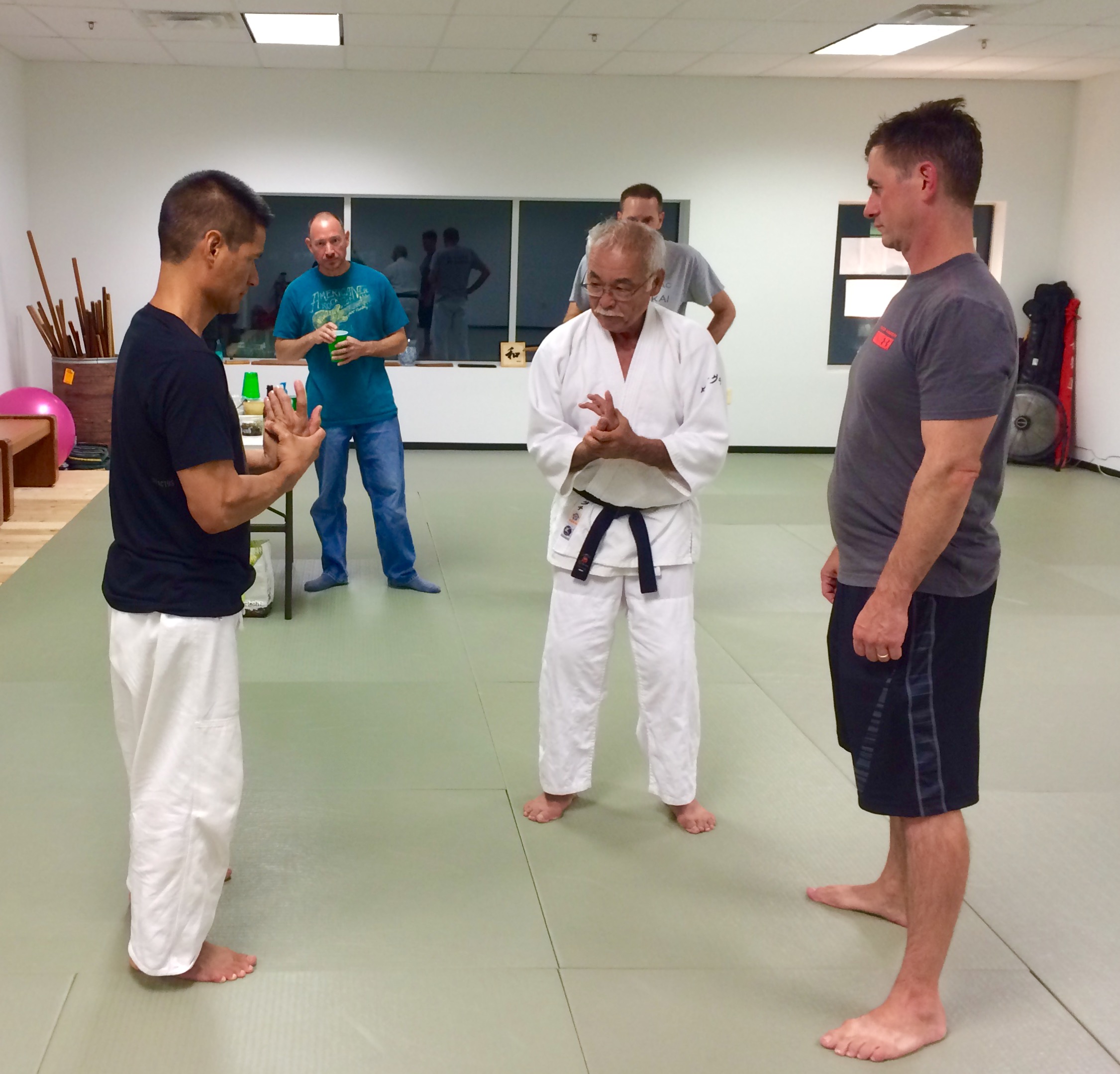  Takeguchi Sensei discussing finer points of Kotegaeshi with Kyle Chock and Tom Boggs. Greg Hilgenberg and Keith Burmaster in background.