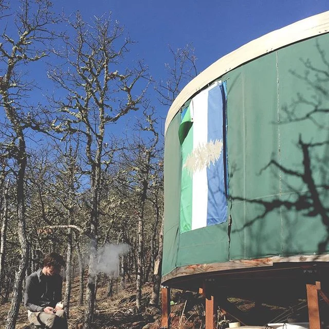Cascadia flag flying at Ritual Grounds Eco-Village
