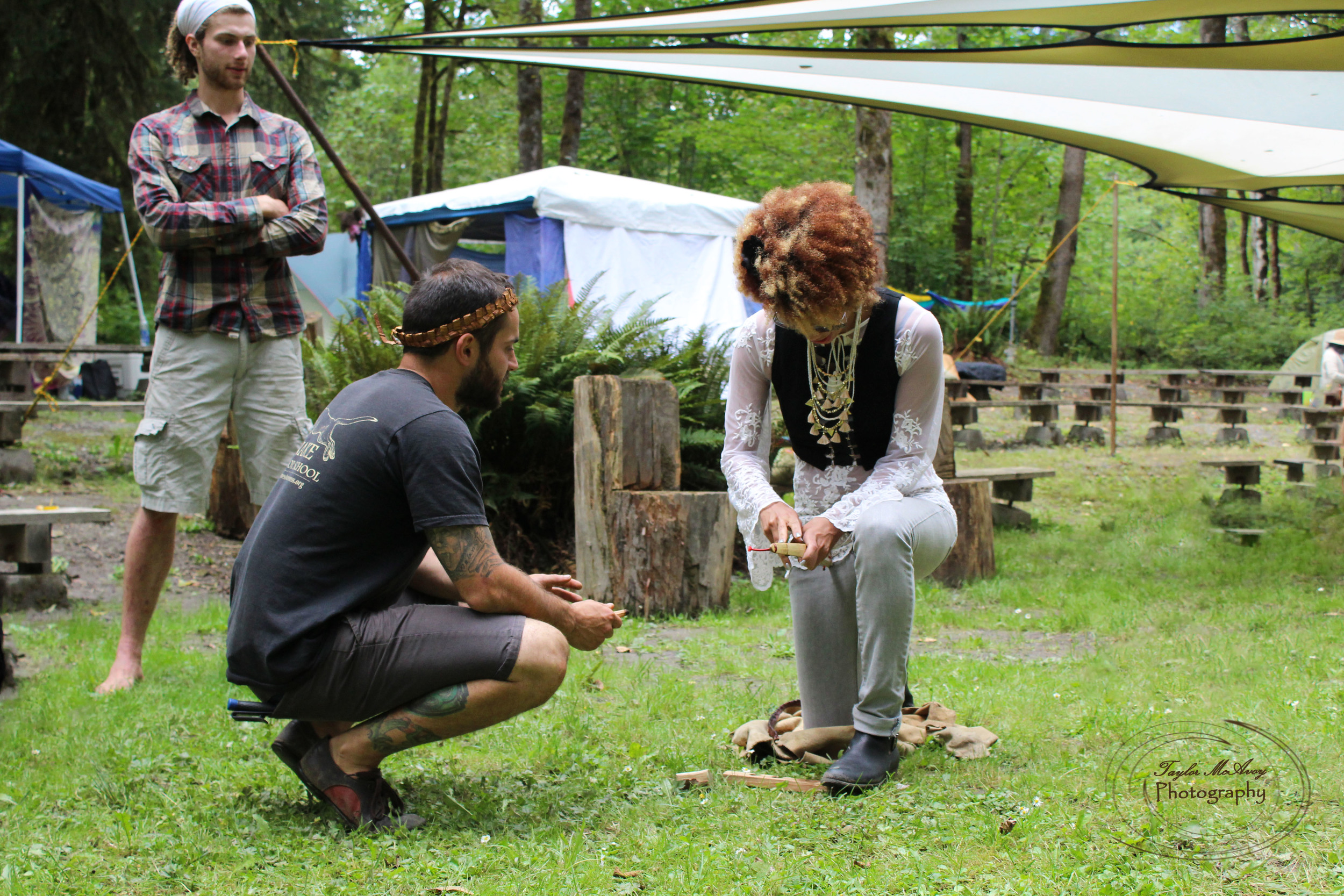  Instructors held a workshop to teach campers how to awaken fire out of natural materials of the forest.&nbsp; 