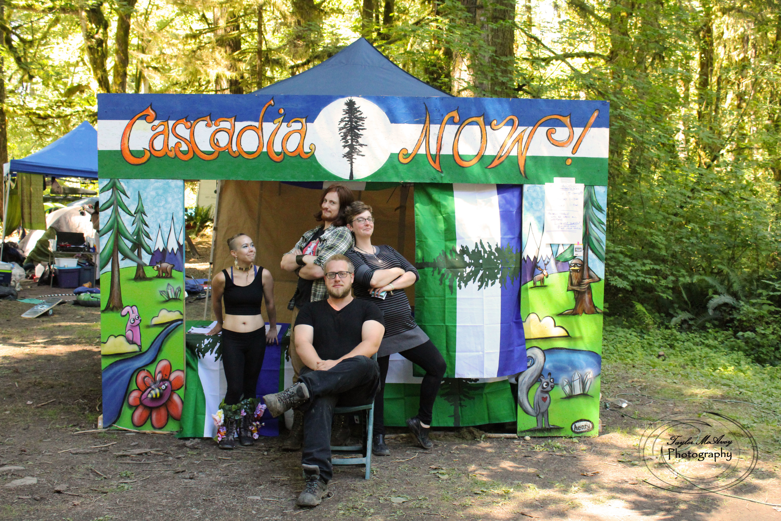  The CascadiaNow! squad posed in front of our booth painted by Seattle artist Ryan Henry Ward. 