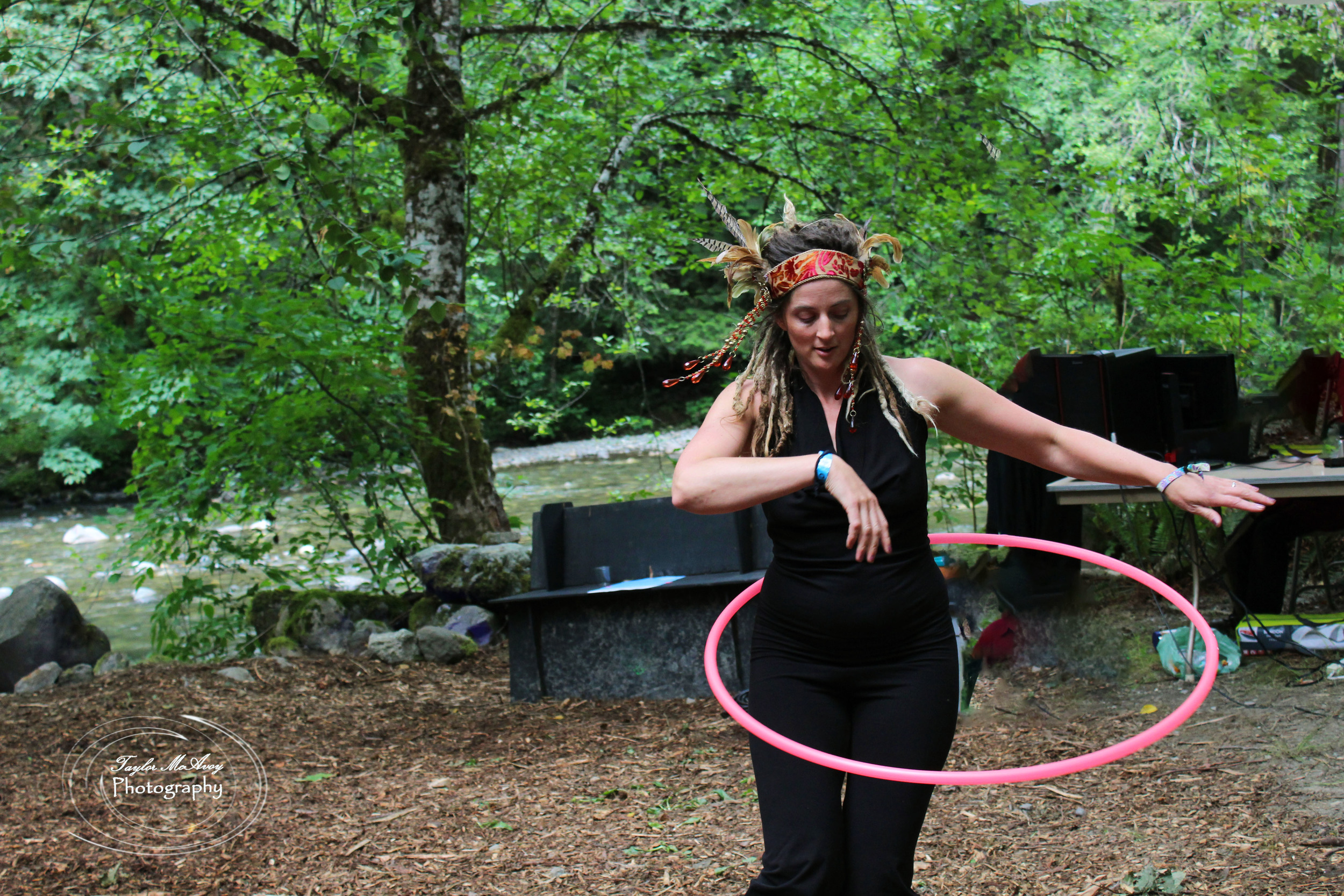  Levi Joy Aley practices hoop dancing by the river.&nbsp; 