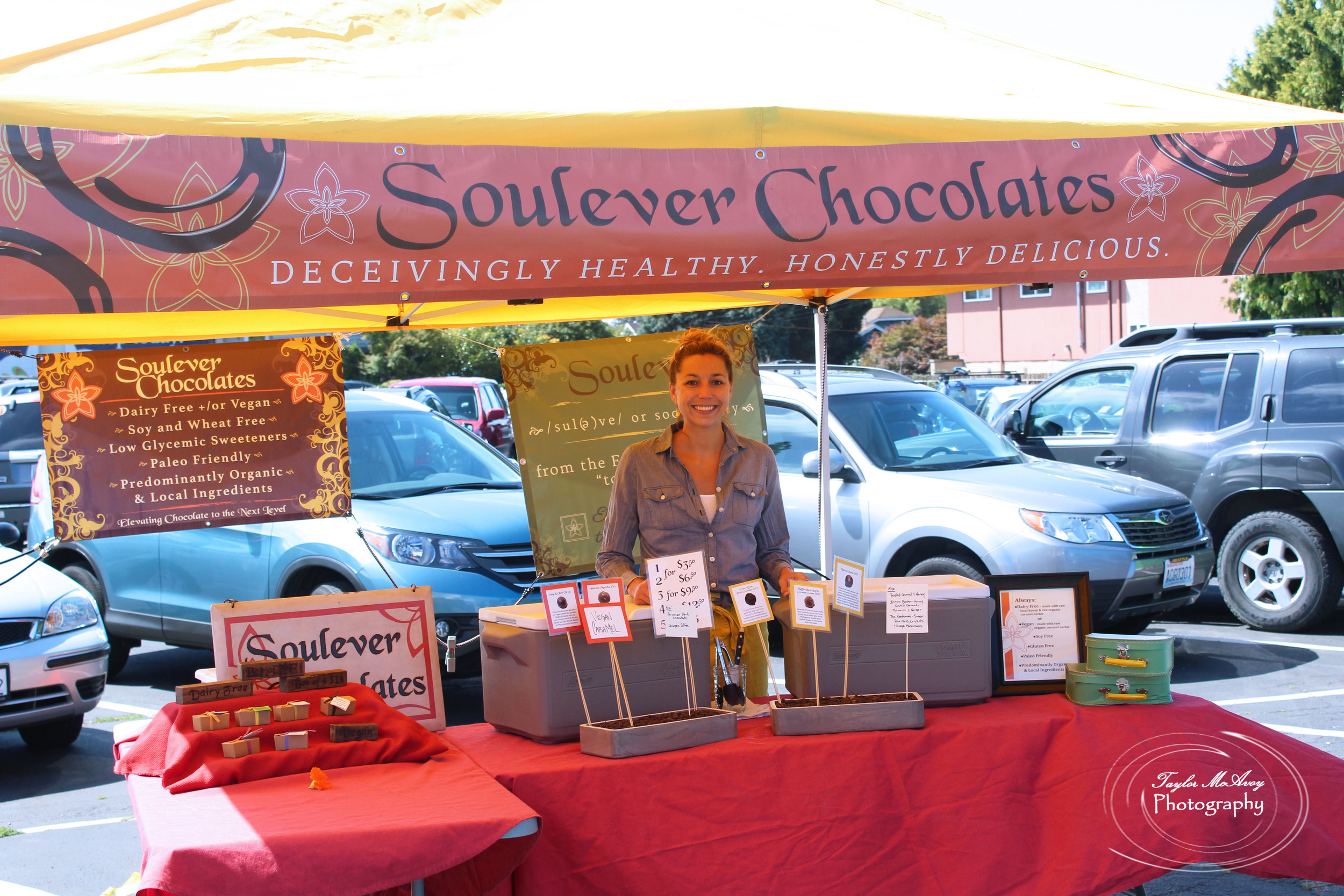  Creator of Soulever Chocolates, Aimee Morrow waits at her booth to hand out chocolate samples. This is Aimee's first year setting up at the P-Patch. 