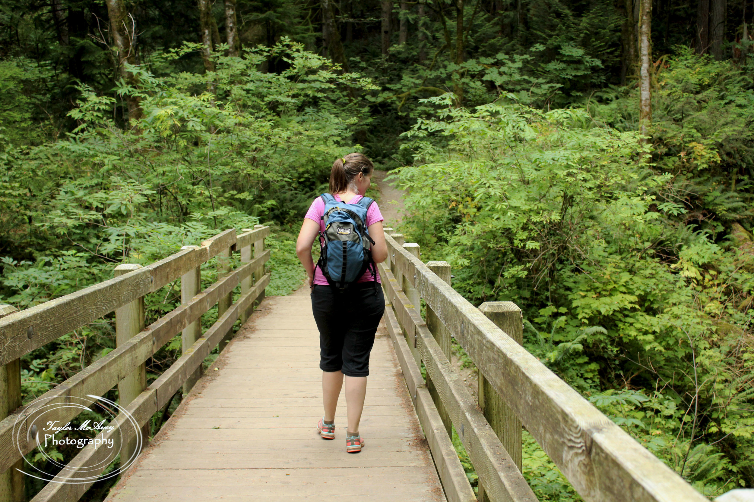  Caryl Bauwens gazes at a small waterfall along the trail. 