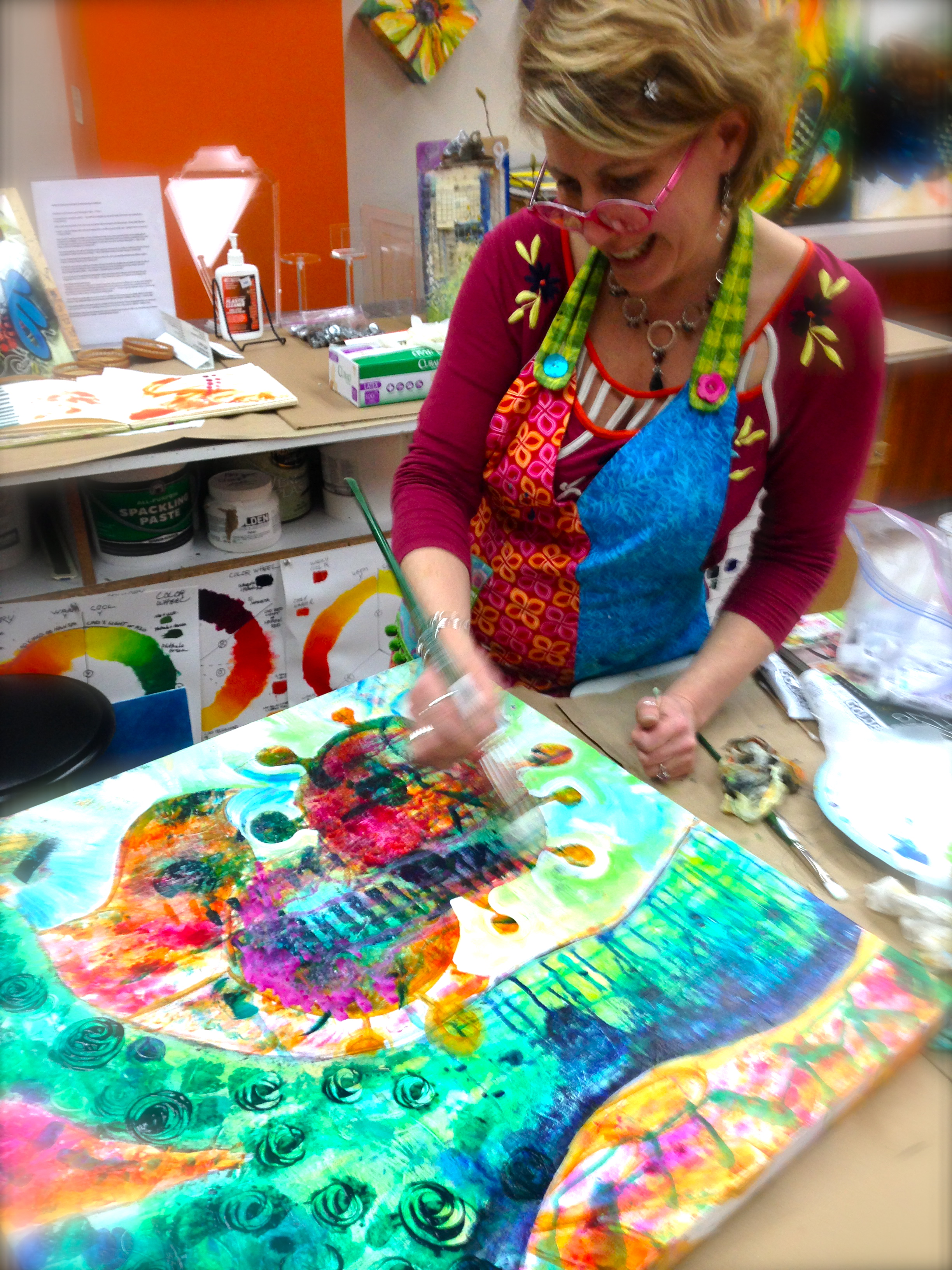 Sam painting an abstract self portrait at the ARTspot Studio.