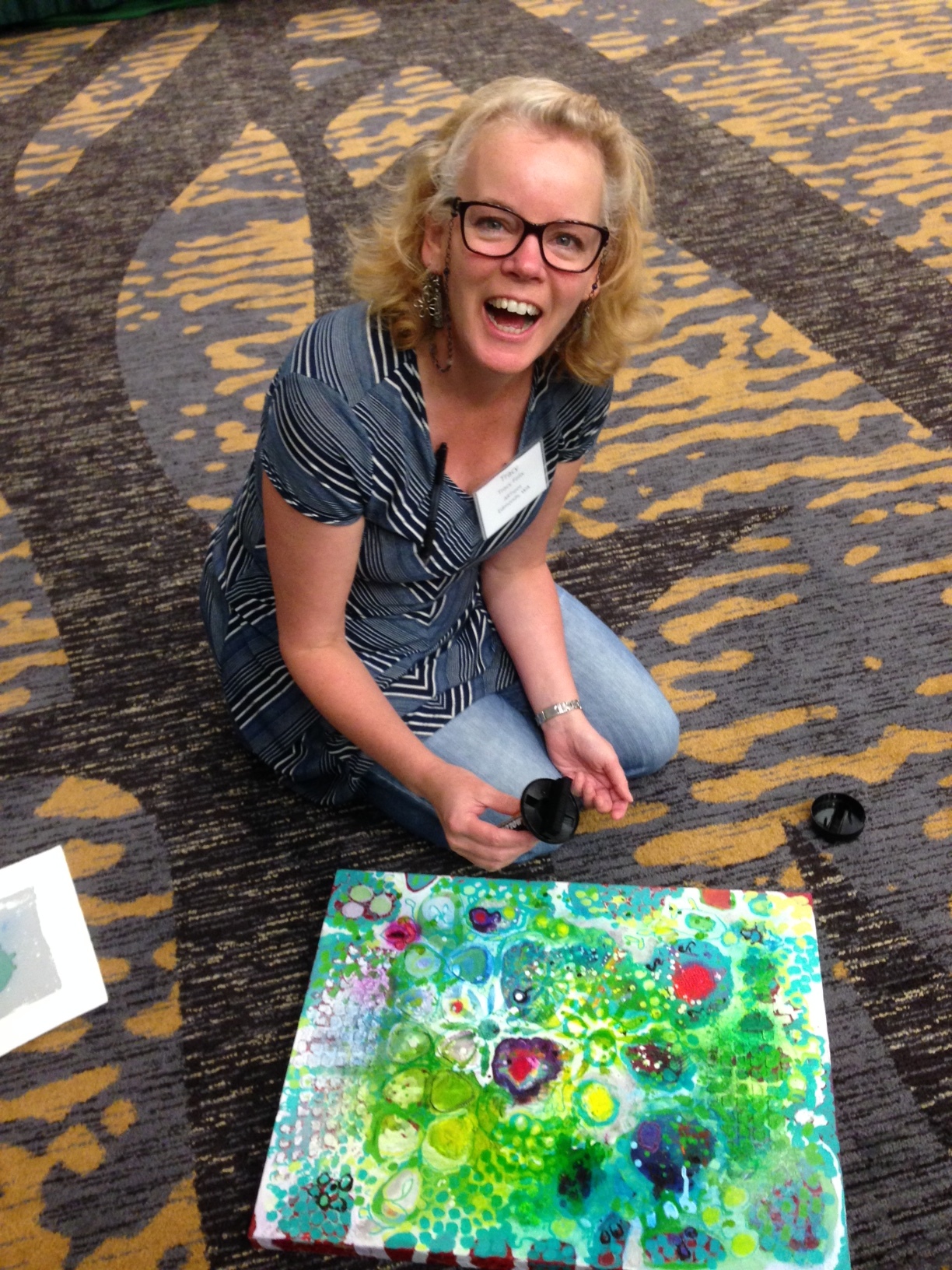 ARTspot owner Tracy Felix getting ready to paint over her favorite painting so far. Images of her first 10 paint-overs at top of page. Just do it!