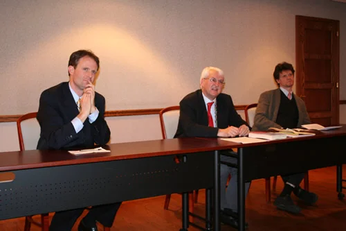 Andreas Riecken (left), charge d'affaires, welcomed Bischof and co-panelist Steven Beller (right) to the book presentation.