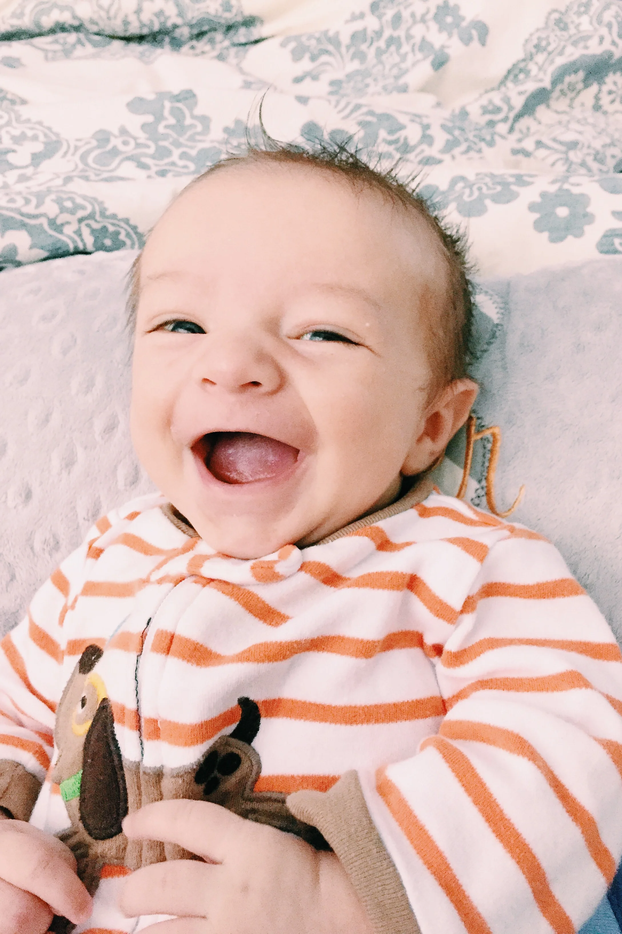 First social smiles at 7 weeks, oh what we now will do to evoke these grins!