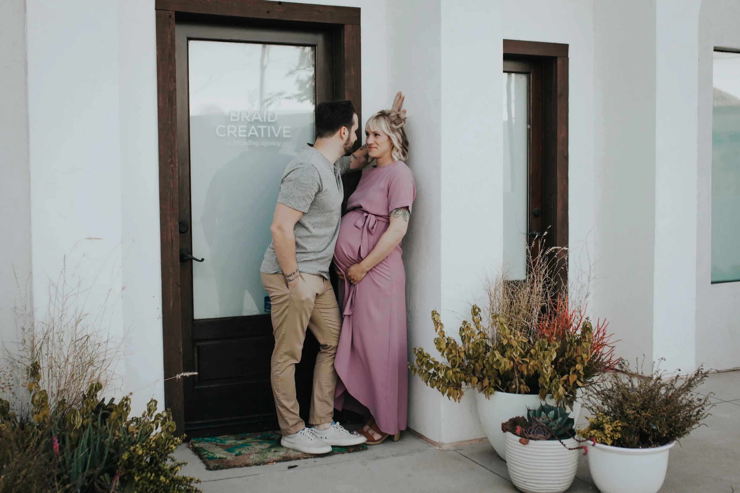 Image of a couple posing for a maternity portrait