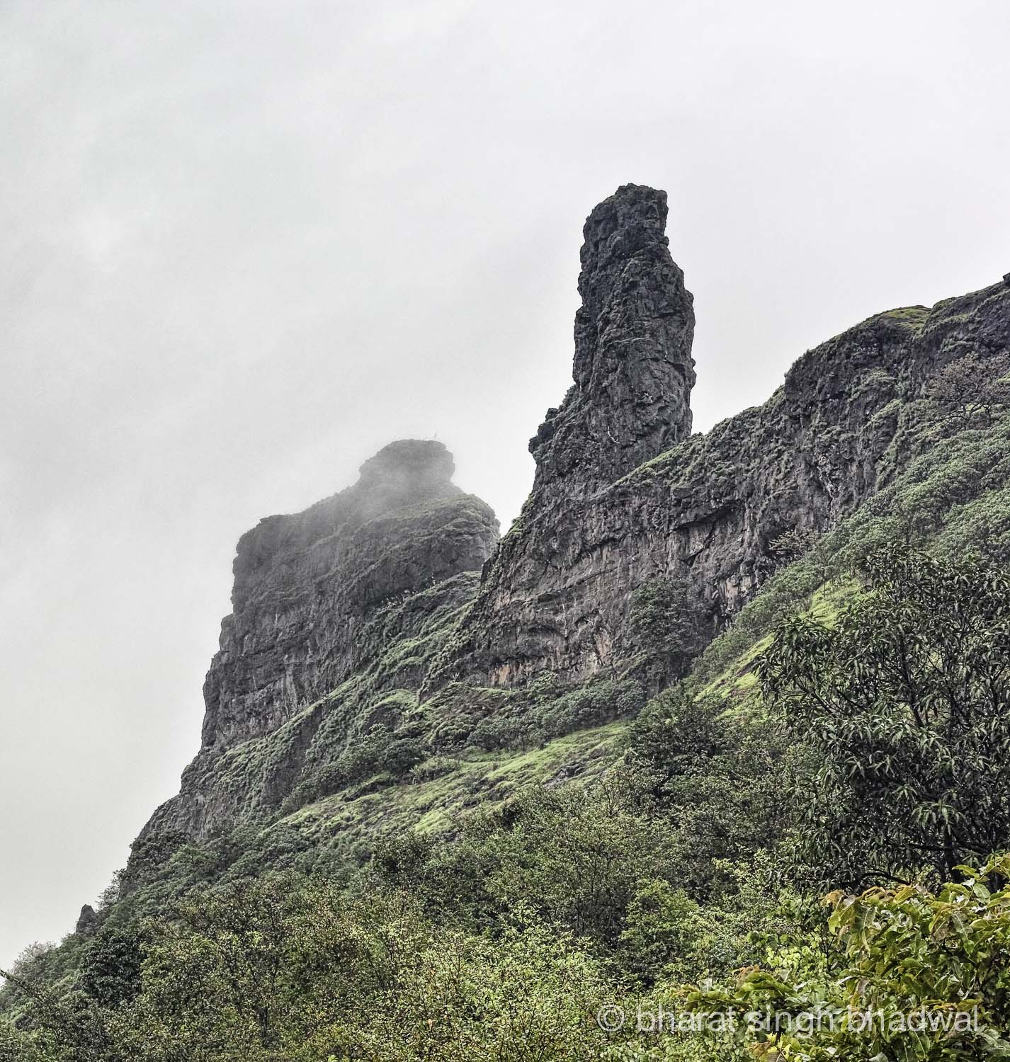 Irshalgad pinnacle draped in clouds