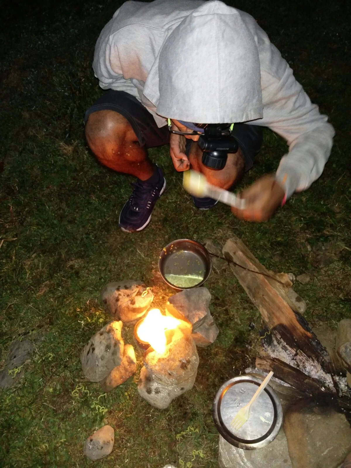 Nikhil and friends using an alcohol stove in the field (on Brighu Lake trek)