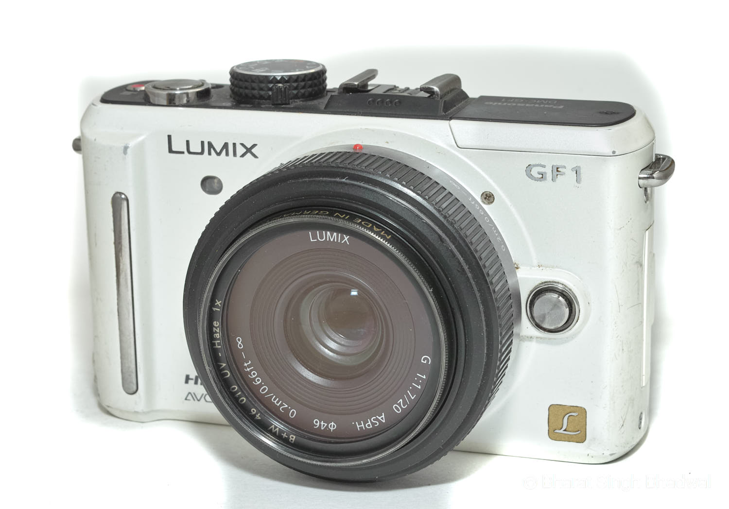 Our Panasonic GF1 with a broken battery lock door and cracked LCD. Still works perfectly though!