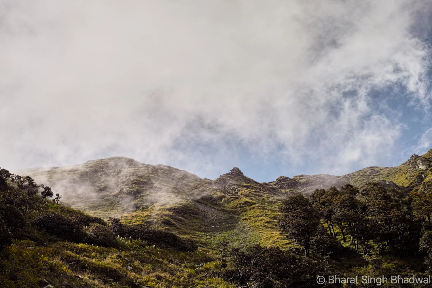 The climb to Jalsu Pass. The low flying clouds make way for a sunny pass.