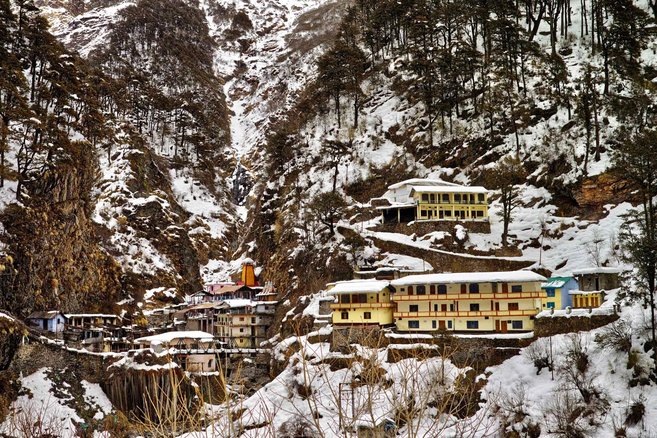Yamunotri temple (orange building with a snow cap) and ashrams and dharamshalas in March 2017 