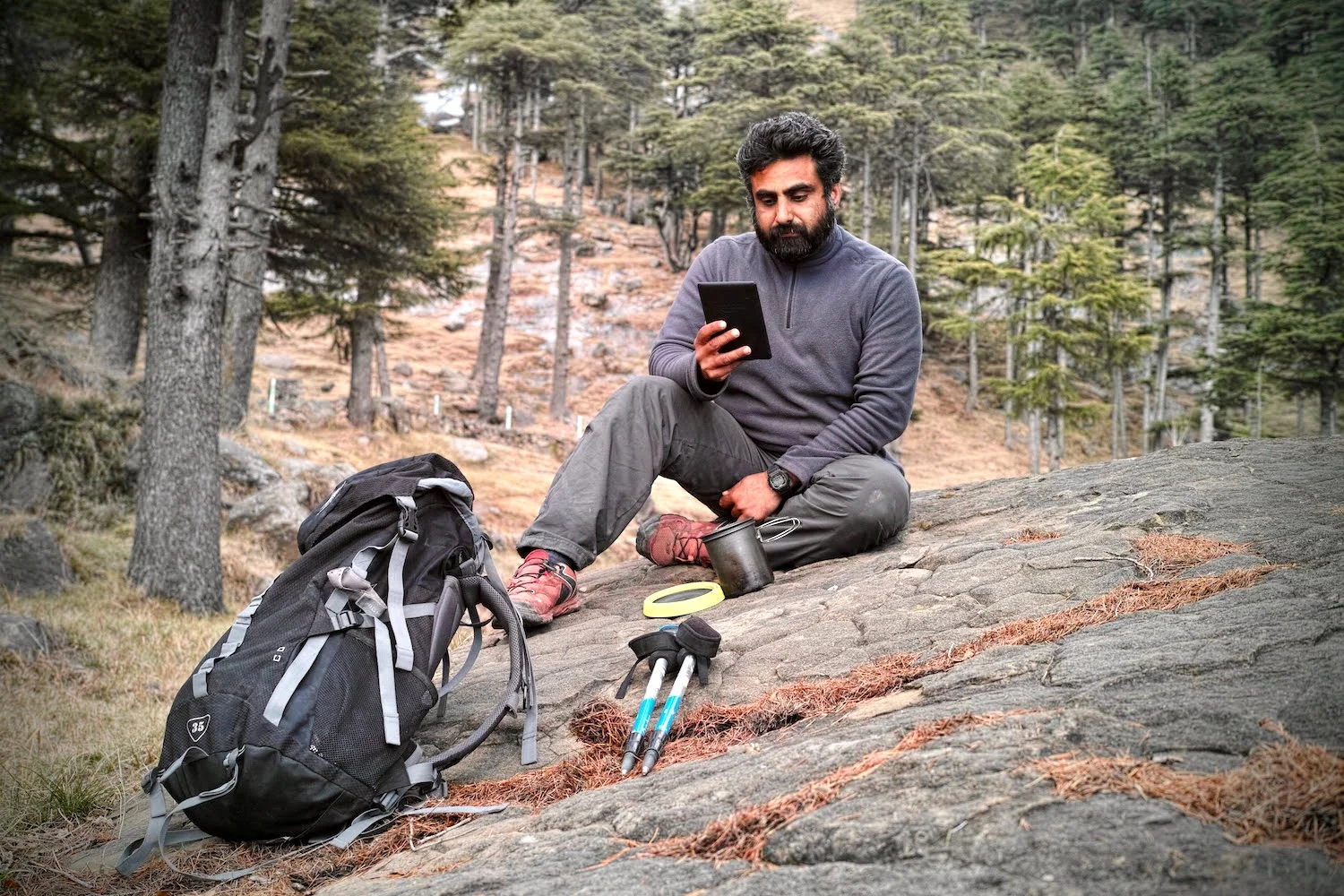Bharat relaxes with his Kindle after a day's hike