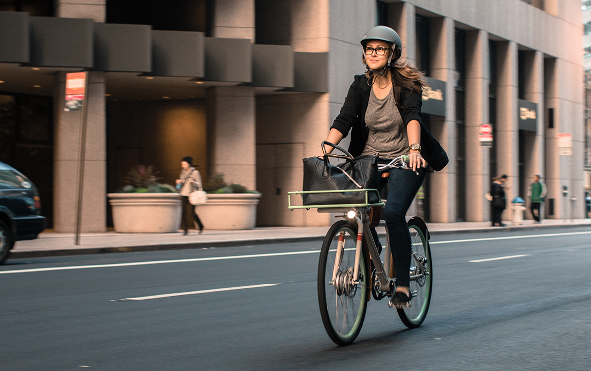 City commuting on an electric bike! Looks like it could be downtown Honolulu...