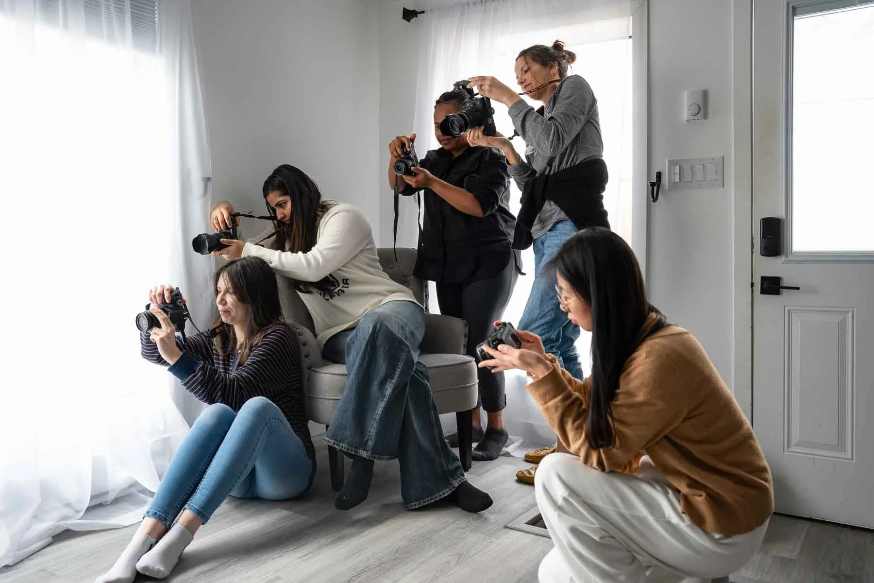 Students learning photography and video during a hands-on content creation course in Winnipeg