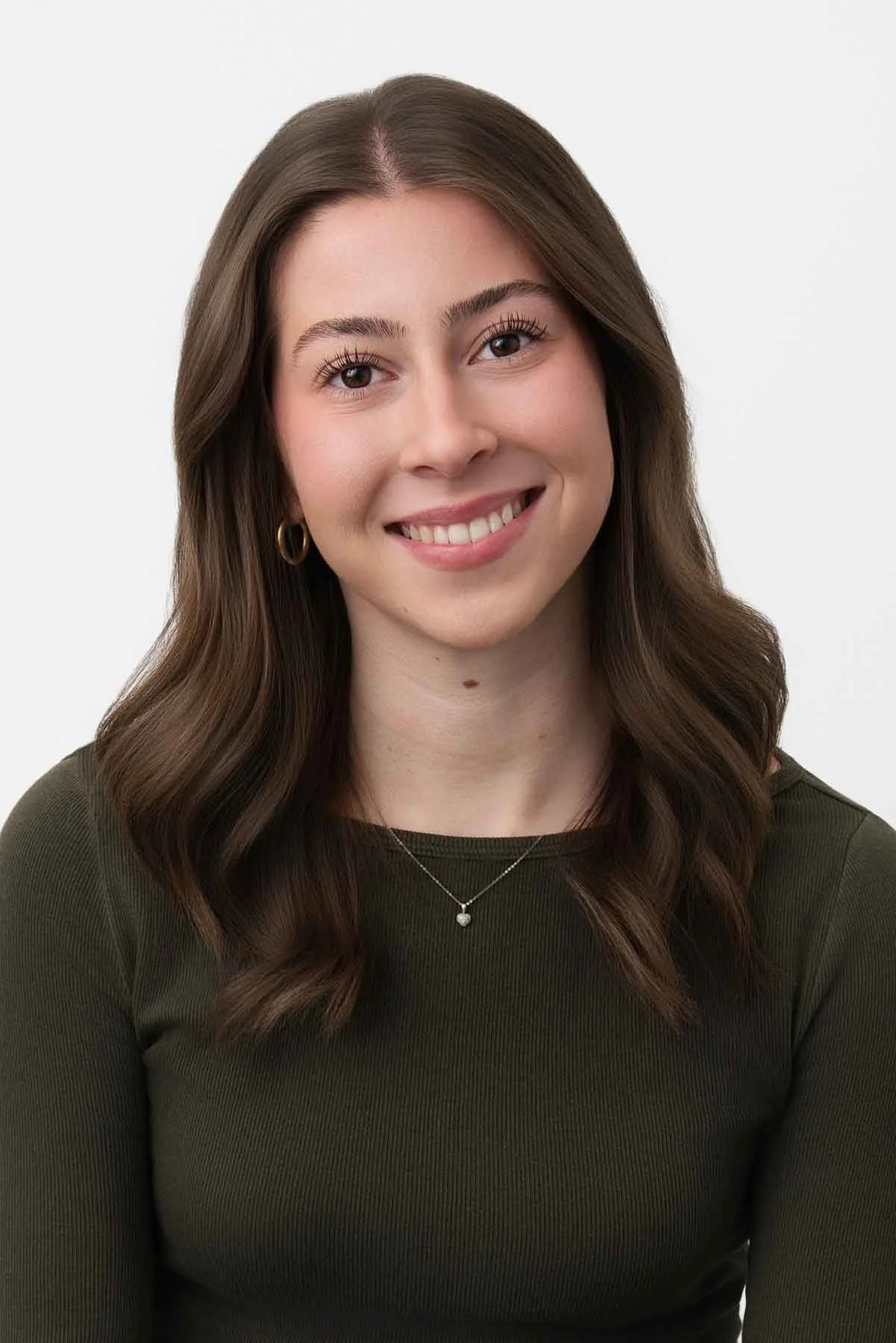 Corporate headshot of a finance professional photographed on a white background by a Winnipeg headshot photographer.