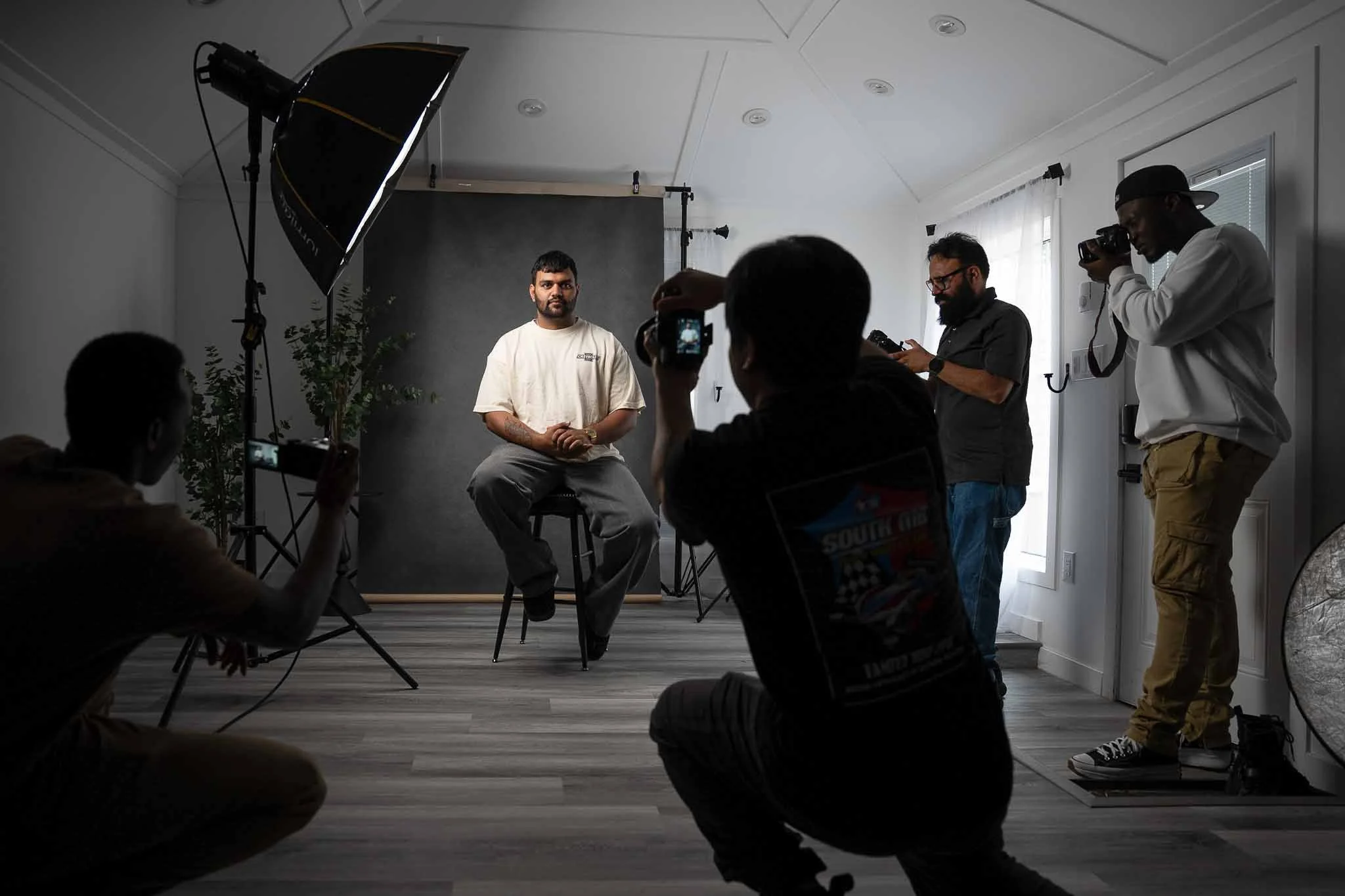 students shooting portraits in the studio during a photography lesson for the content creation course in winnipeg