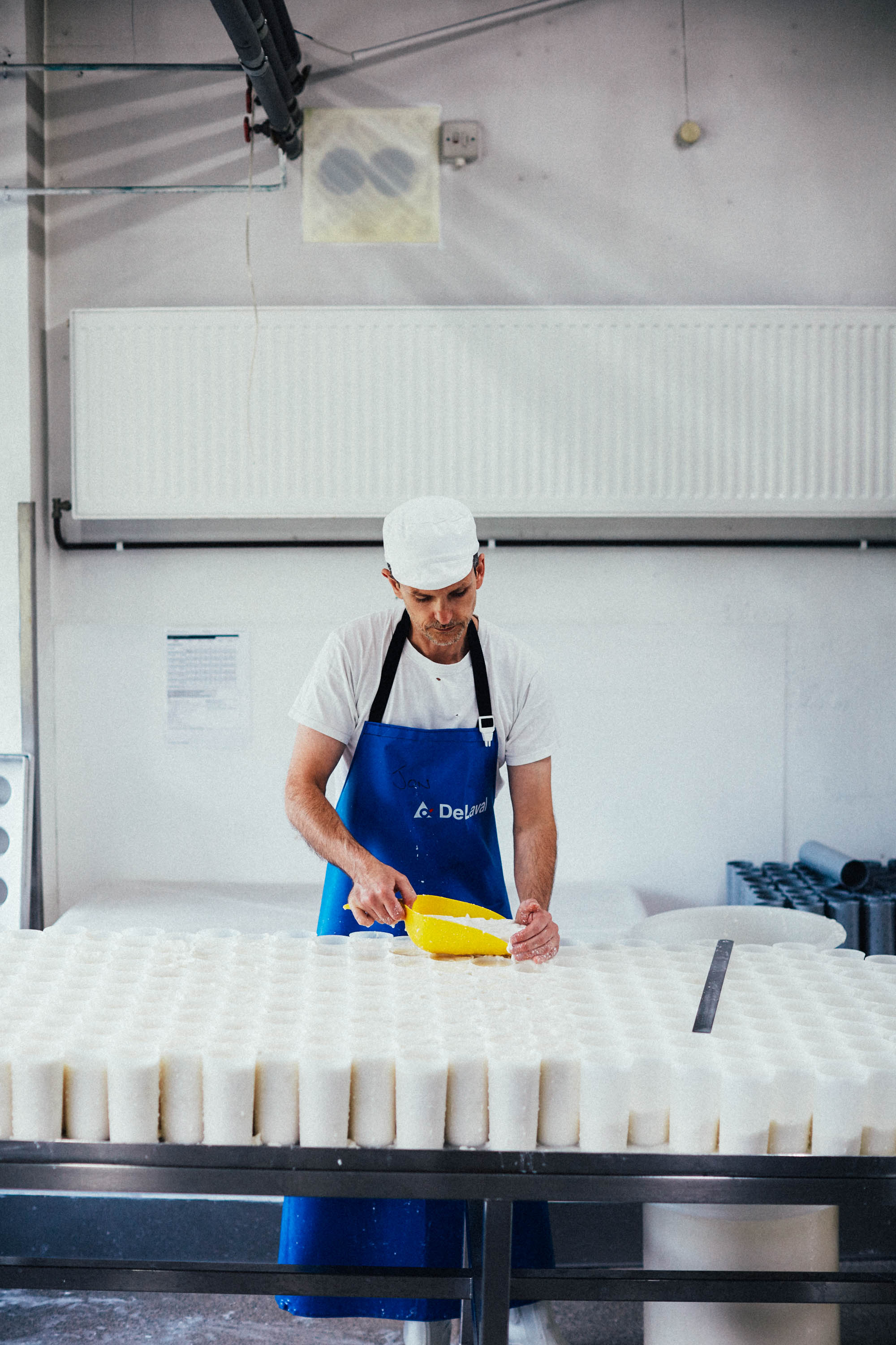 Jon Fills moulds to strain off whey for their Ragstone - a fresh goats cheese.