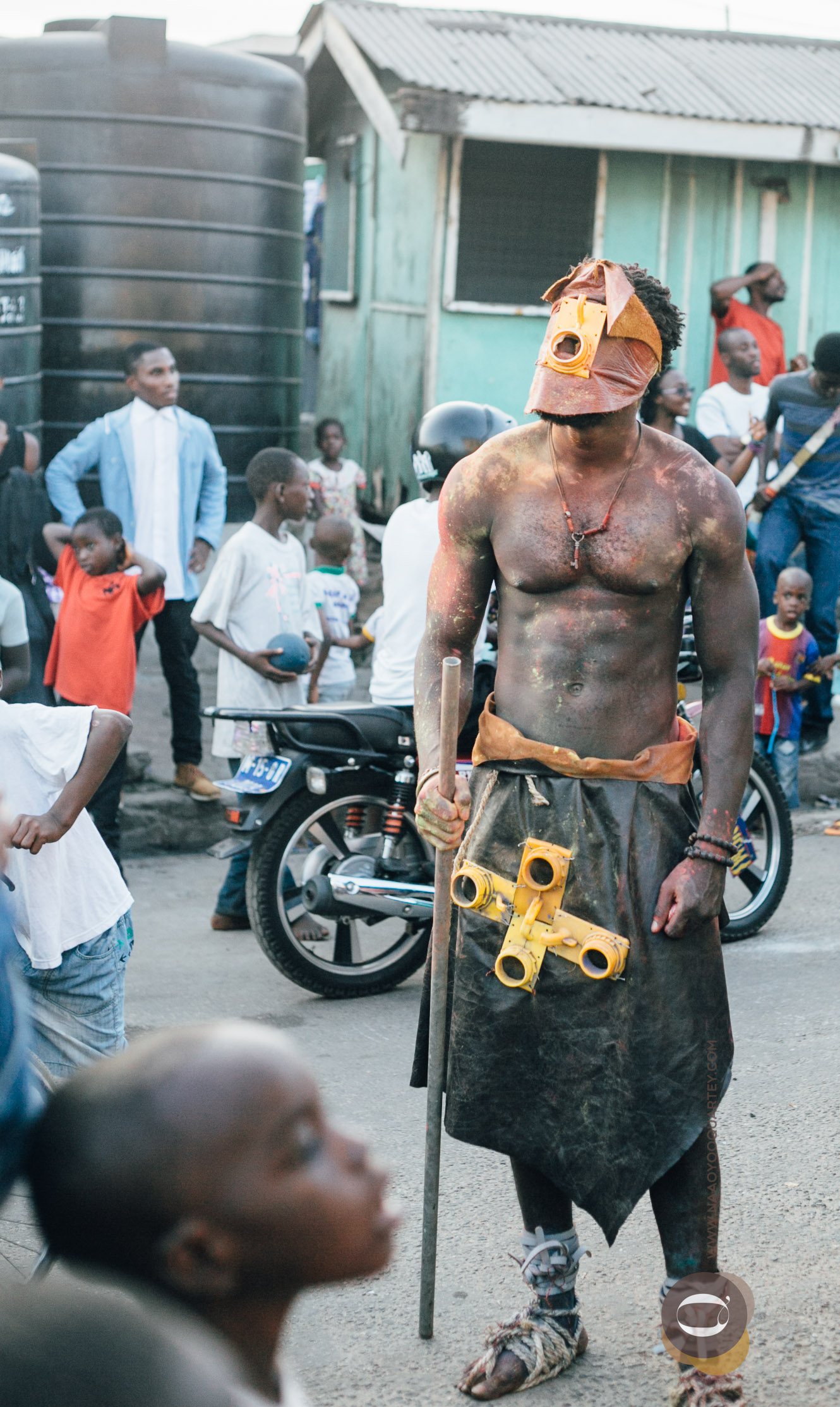the mouthpiece of the yellow gallons used as a mask by a performer during ChaleWote15 