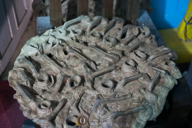 A wood carving inspired by the plastic moulding of yellow gallons. 