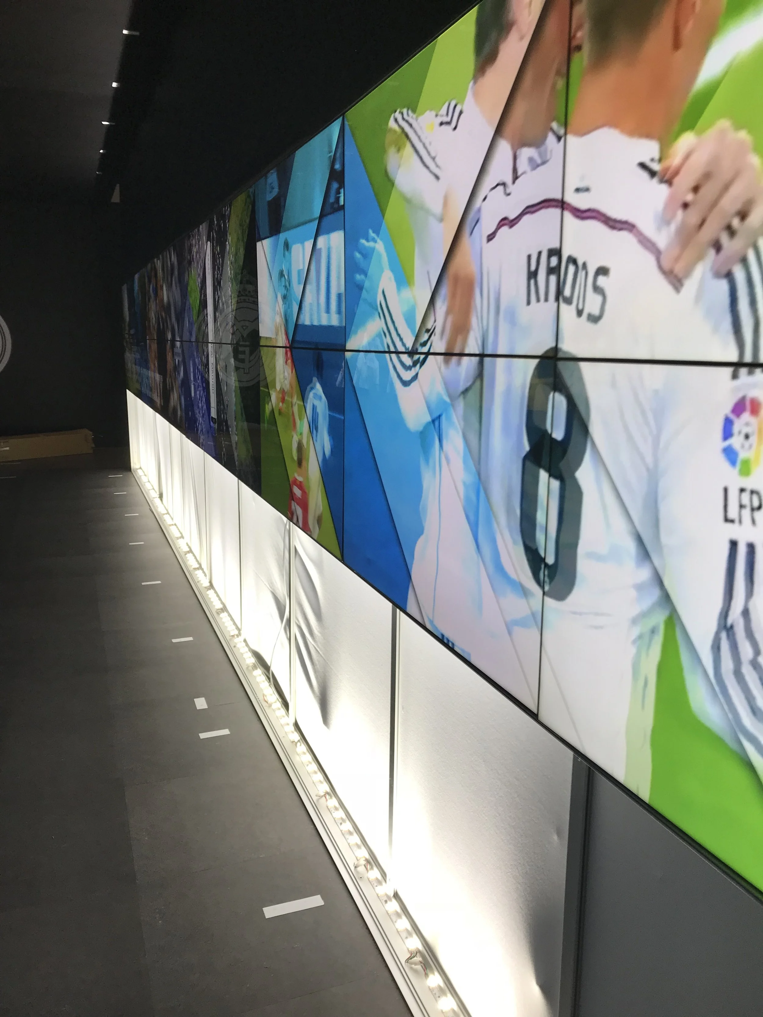 Real Madrid World of Football Experience 2018 - This 38 panel video wall tunnel was programmed & synced by Amped Digital using BrightSign media players - Content by Tania Price immersiv.com.au
