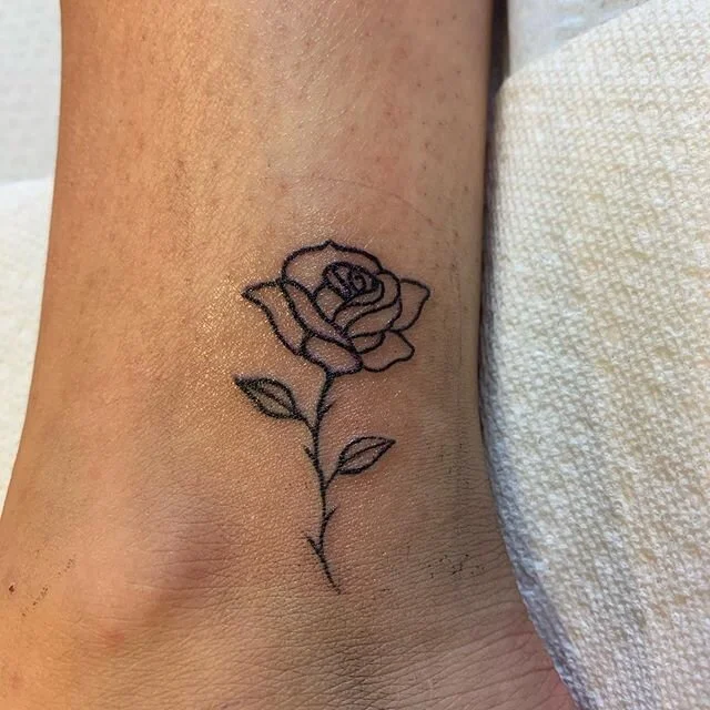 So tiny! @darkhearttattoo  #tattoo #tattoos #rosetattoo #tinytattoo #tinytattoos #flowertattoo