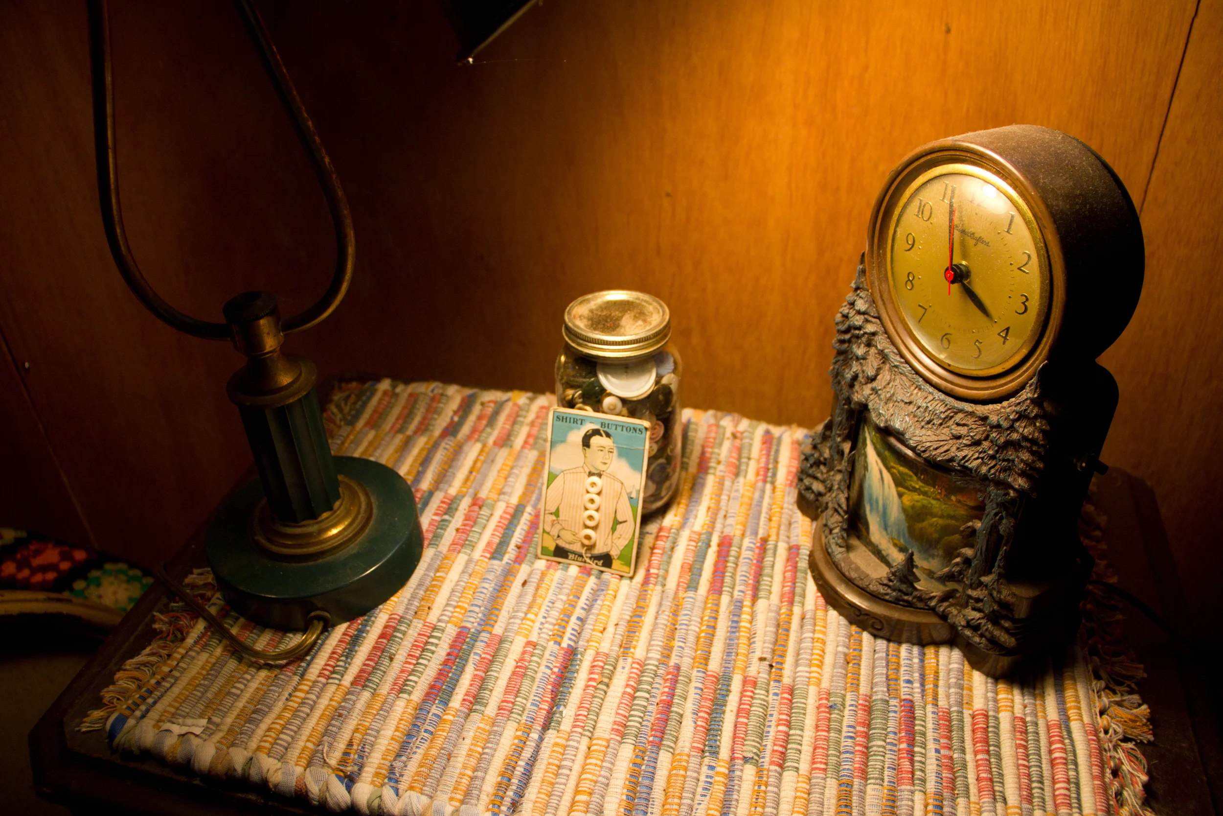 A bedside table with an amazing souvenir clock (by me)