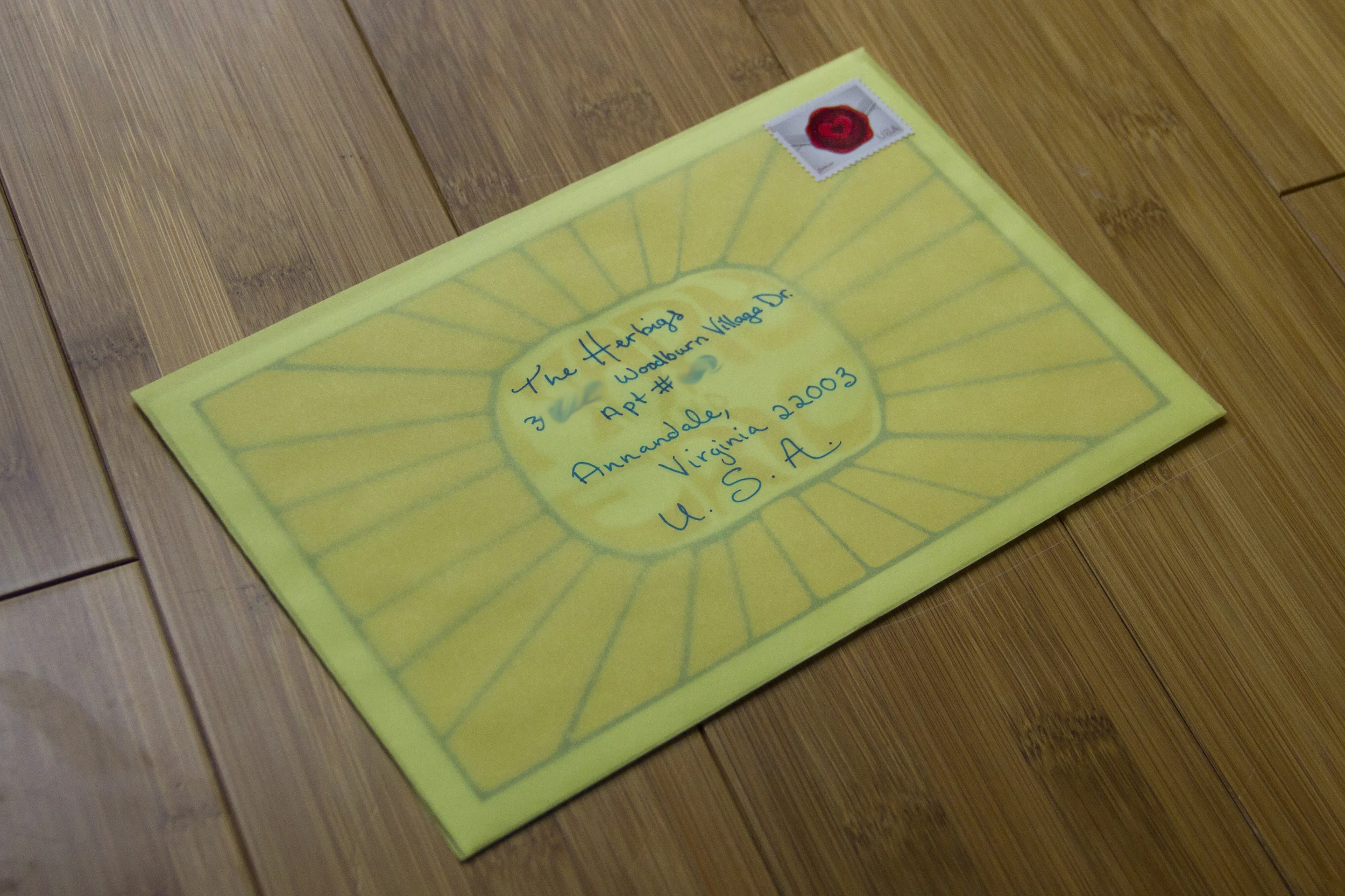 Translucent envelopes allowed me to add the sunburst logo on the back of the "Additional information card" and using tone-on-tone colors meant that the yellow type wouldn't interfere with writing on the envelope.