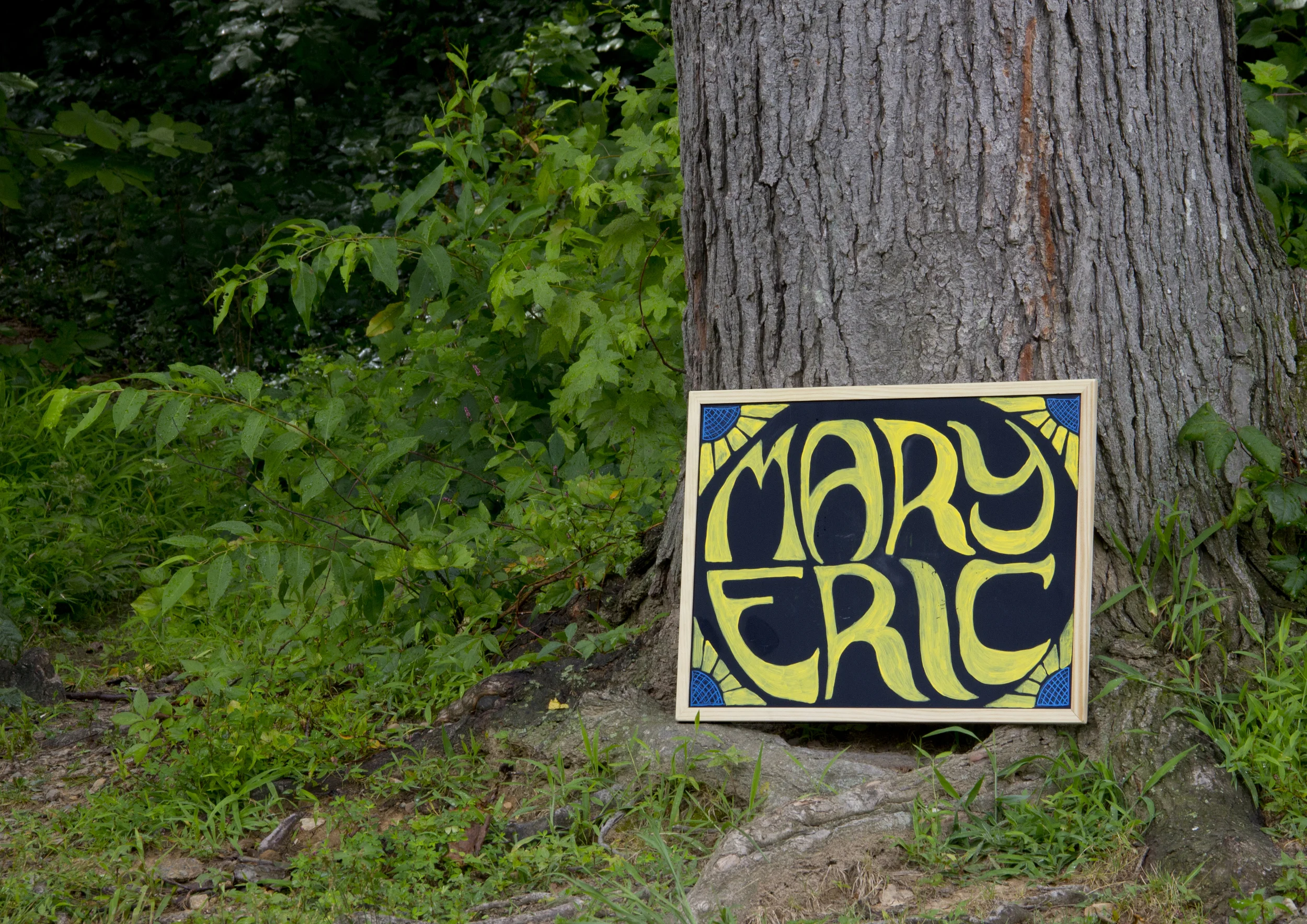The couple asked that a few chalkboard-style signs be created for the wedding day. The board with their names was placed at the venue entrance to help direct guests to the correct location. A menu summarized what to expect for dinner. Both were hand lettered and hand-painted to match the branding on the invitations.