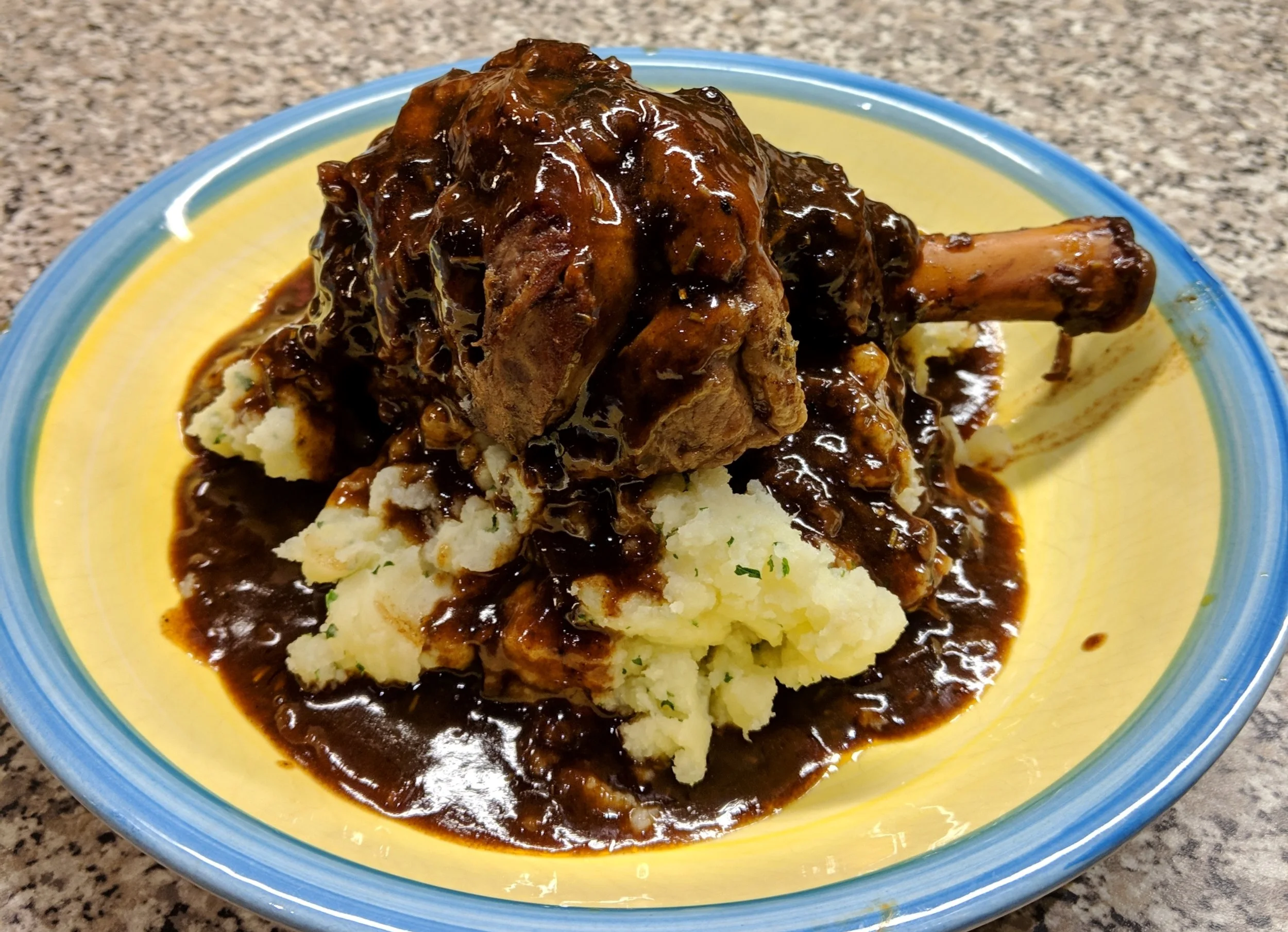 Slow cooked lamb shanks in red wine &amp; onion sauce