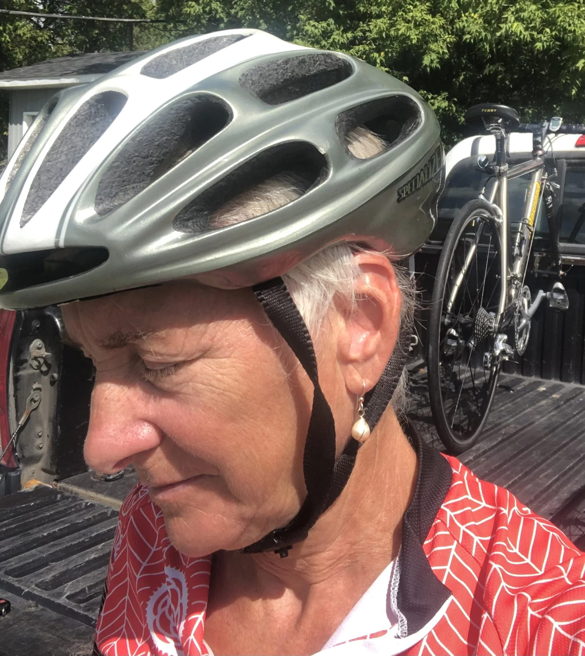 SandraDeeOwens-armsaround-cycling-canada-easterntownships-louisepenny-monasterystbenoitdulac-handmadejewelry-pearlerrings-helmet.jpg